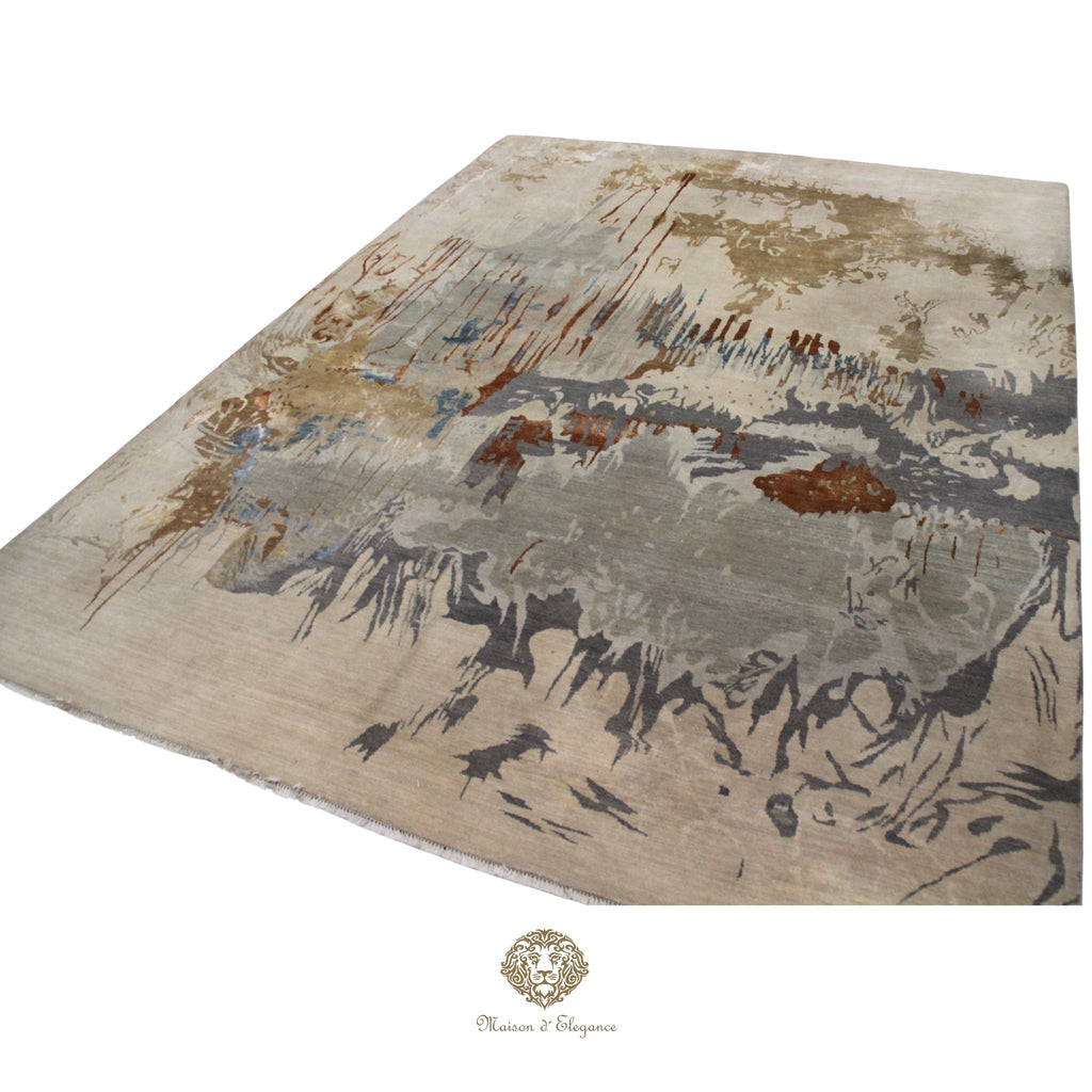 Abstract patterned rug with brown, beige, and gray colors on a Ivory background