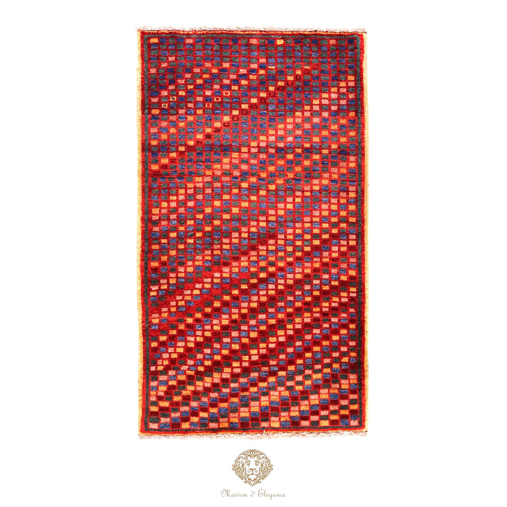 Rectangular rug with a geometric pattern on a red background