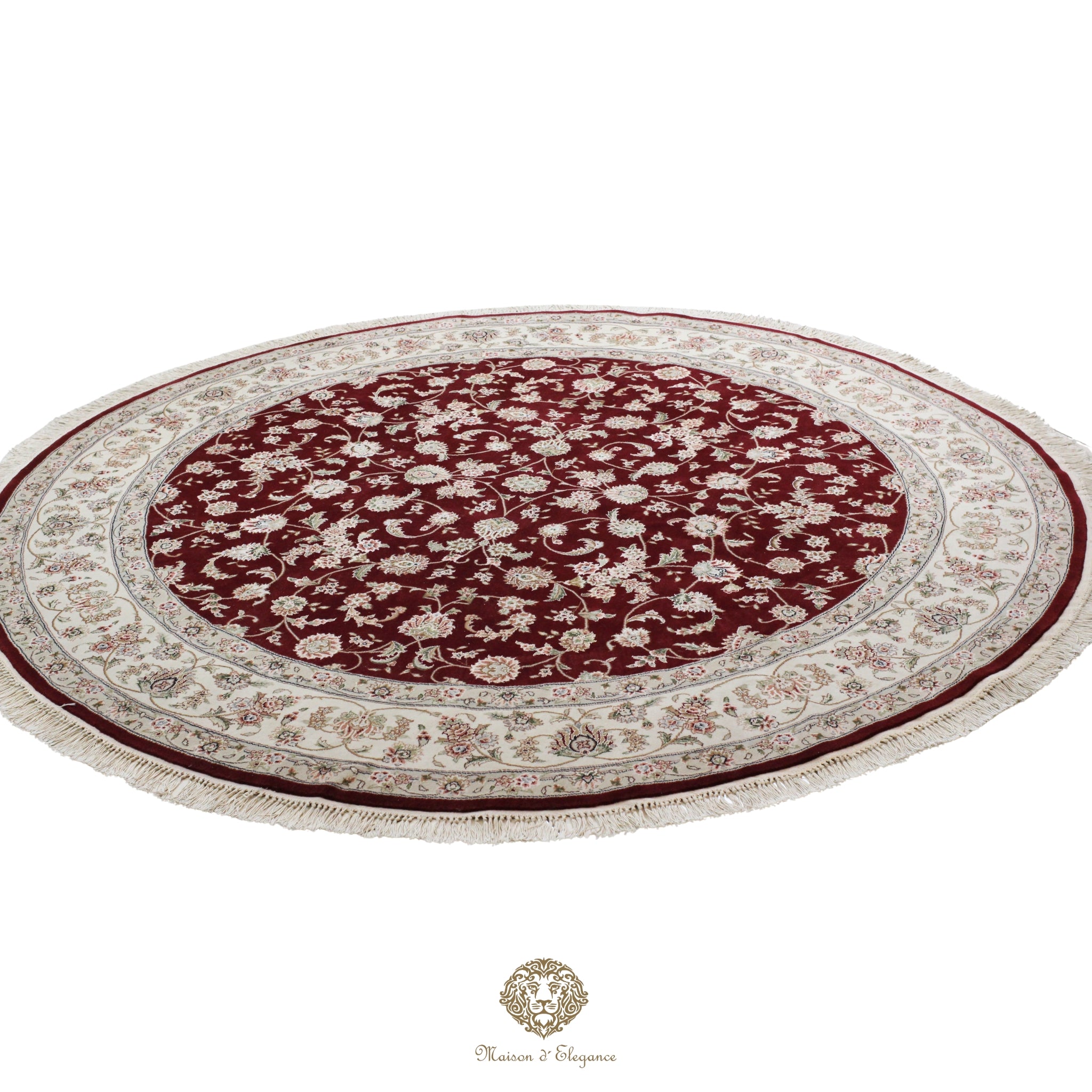 Round red and beige patterned rug on a red background