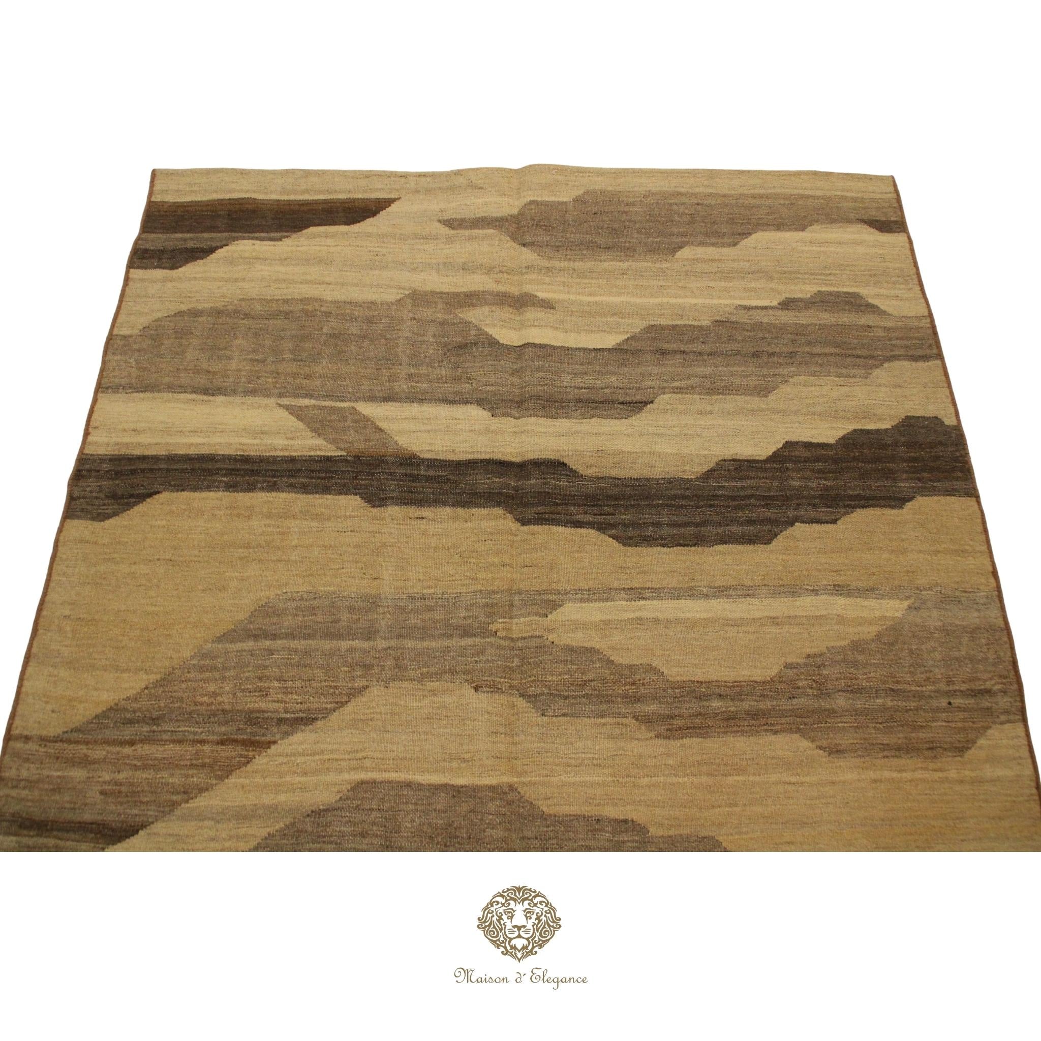 Camouflage-patterned rug with a brand logo at the bottom right corner on a Ivory background