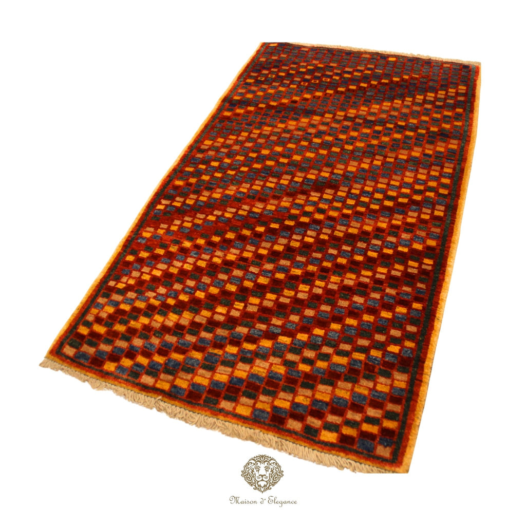 Woven rug with a geometric pattern on a red background