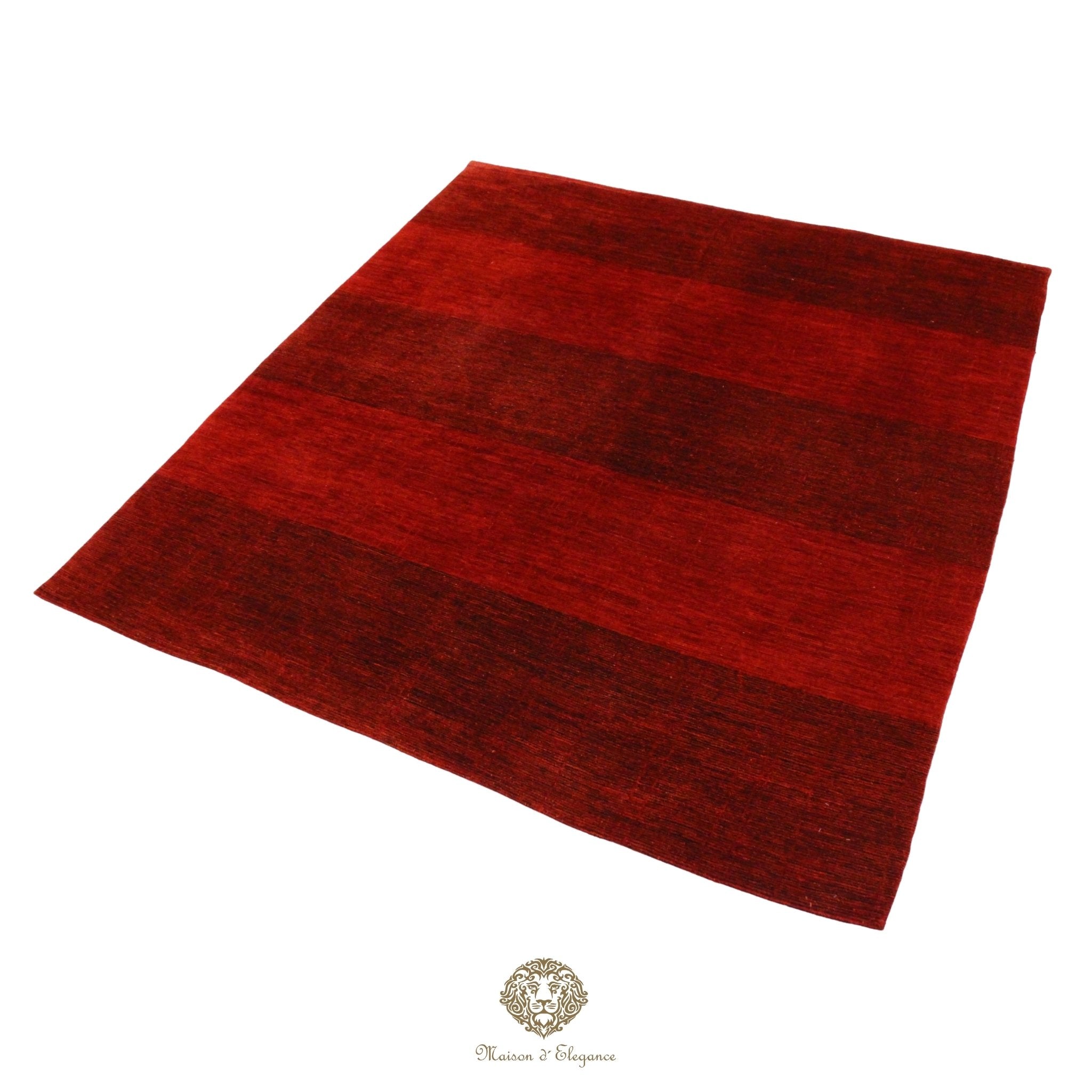 Red rug on a red background with a brand logo at the bottom.