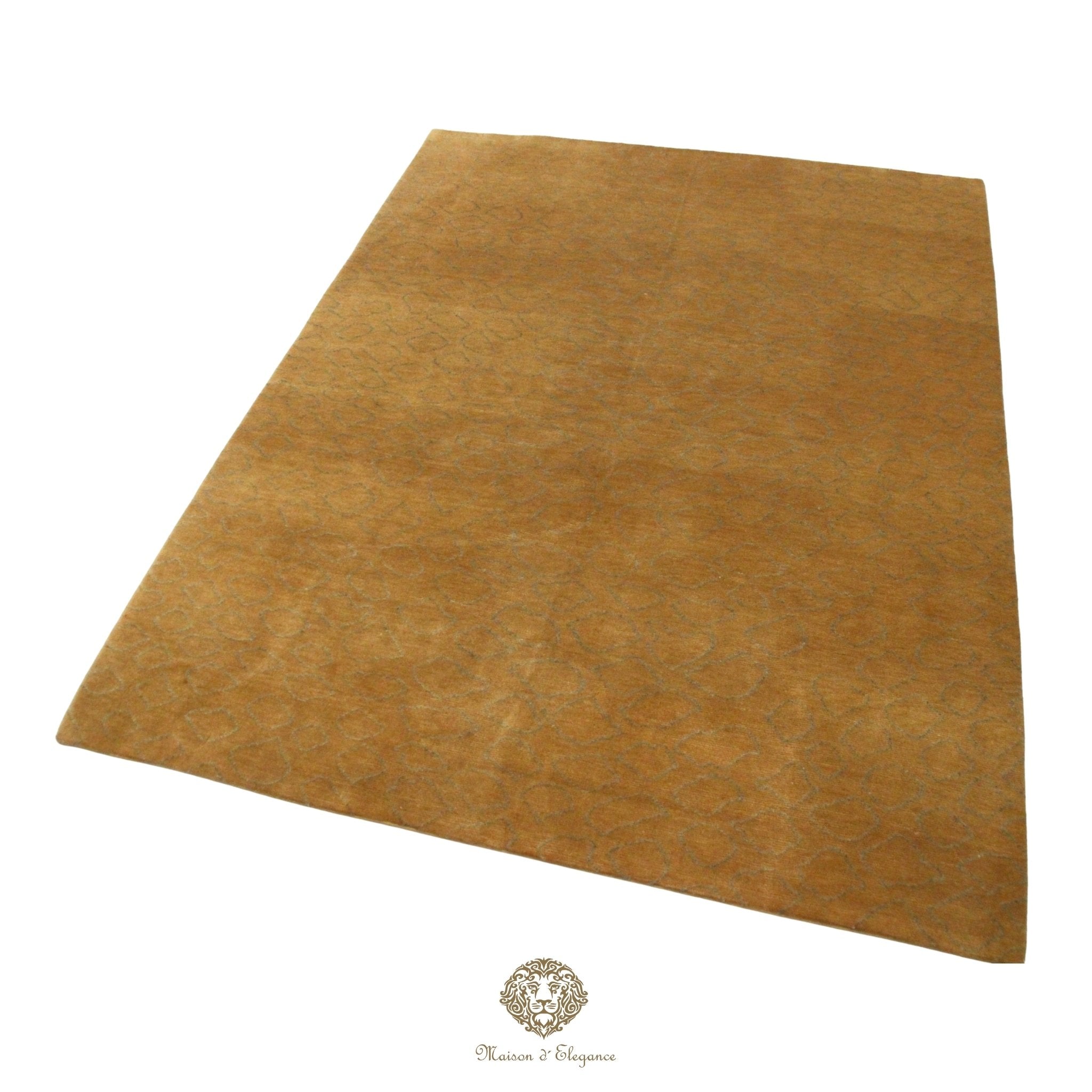 Brown rug with a brand logo at the bottom.