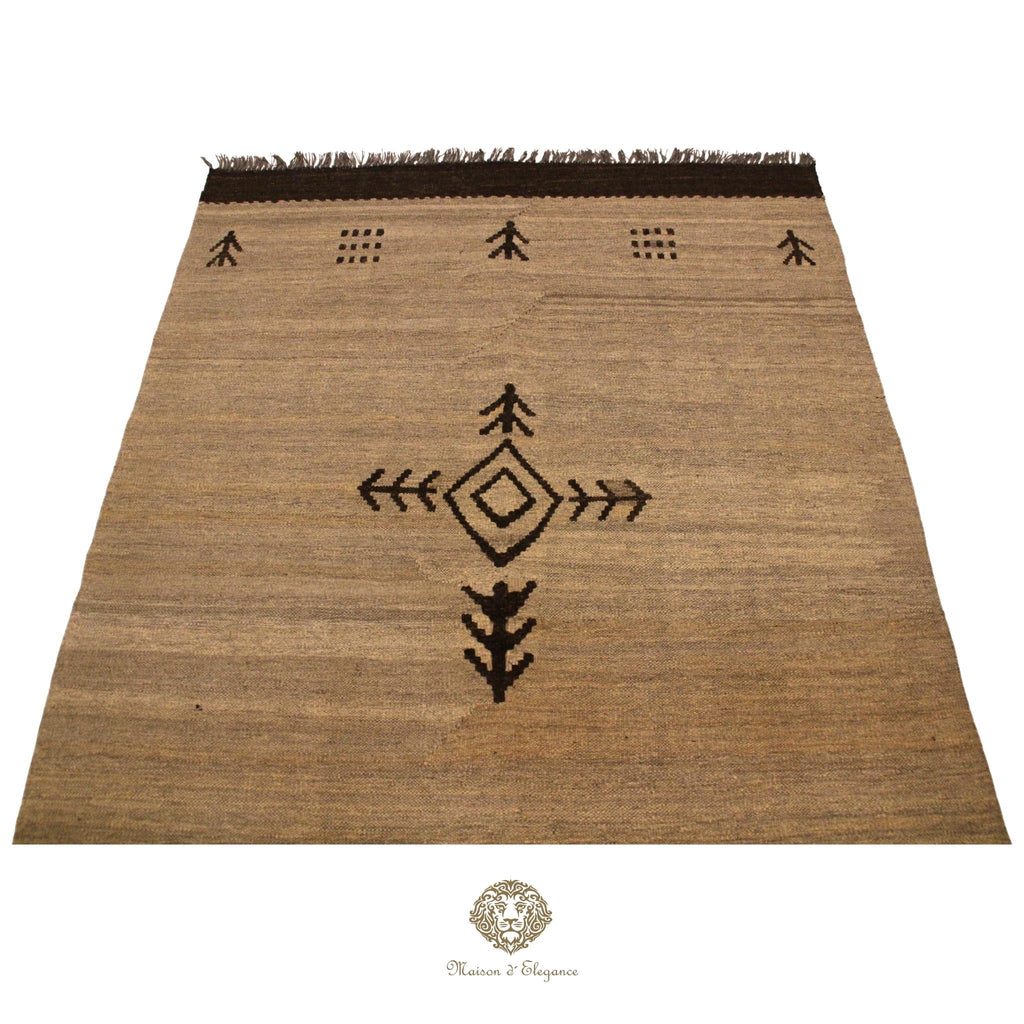 Brown woven rug with black patterns on a ivory background