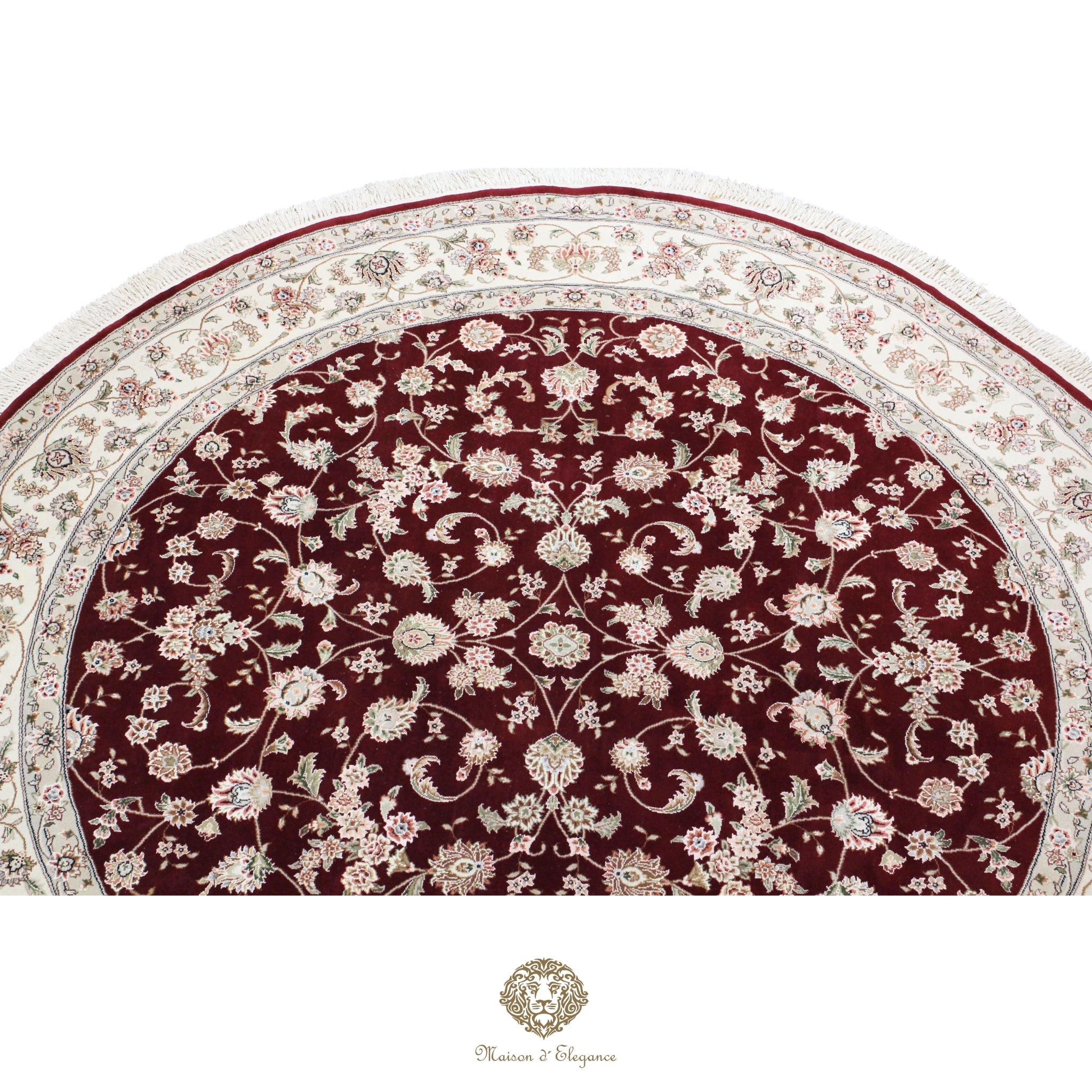 Round floral-patterned rug with intricate design on a red background