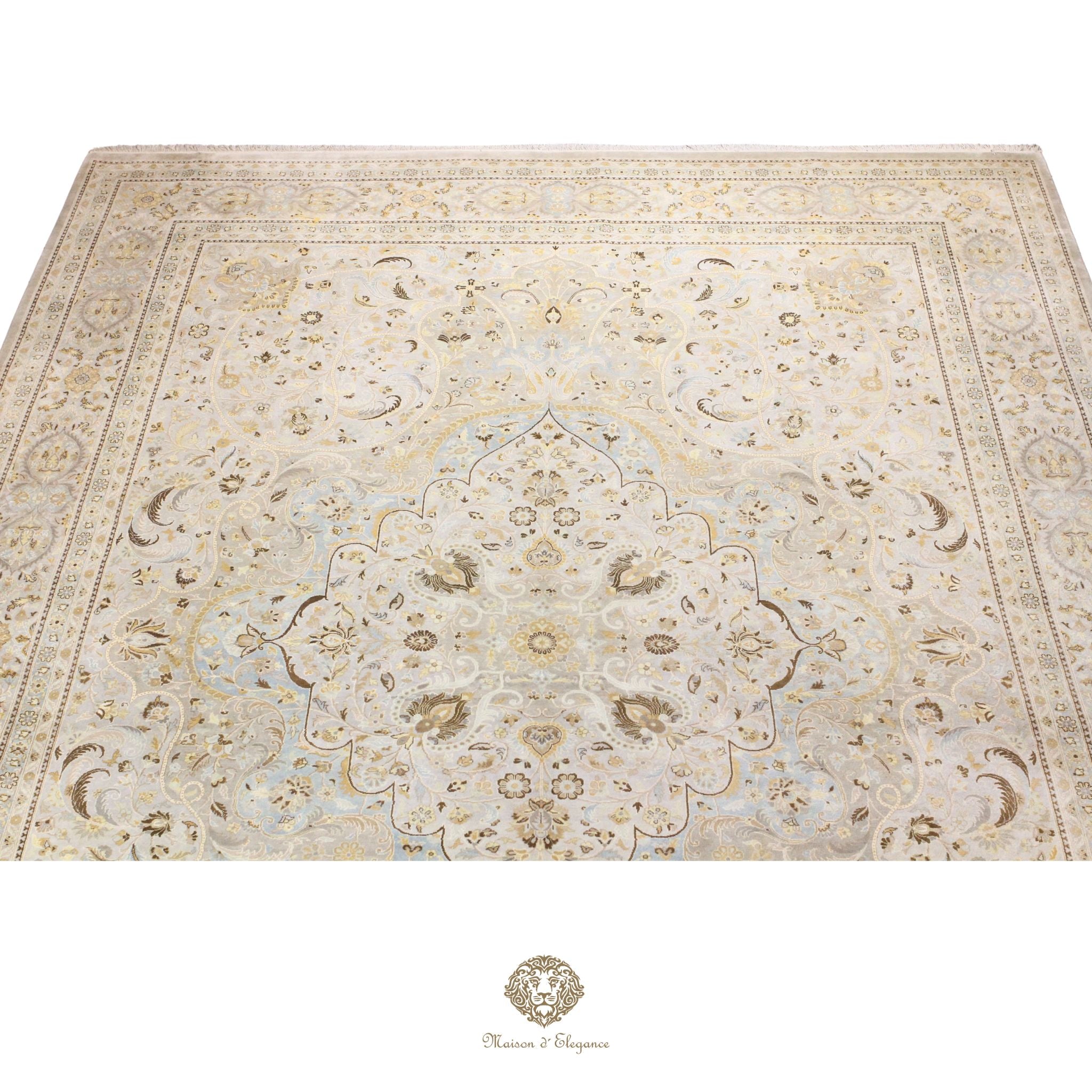Beige patterned rug with intricate designs on a gray background