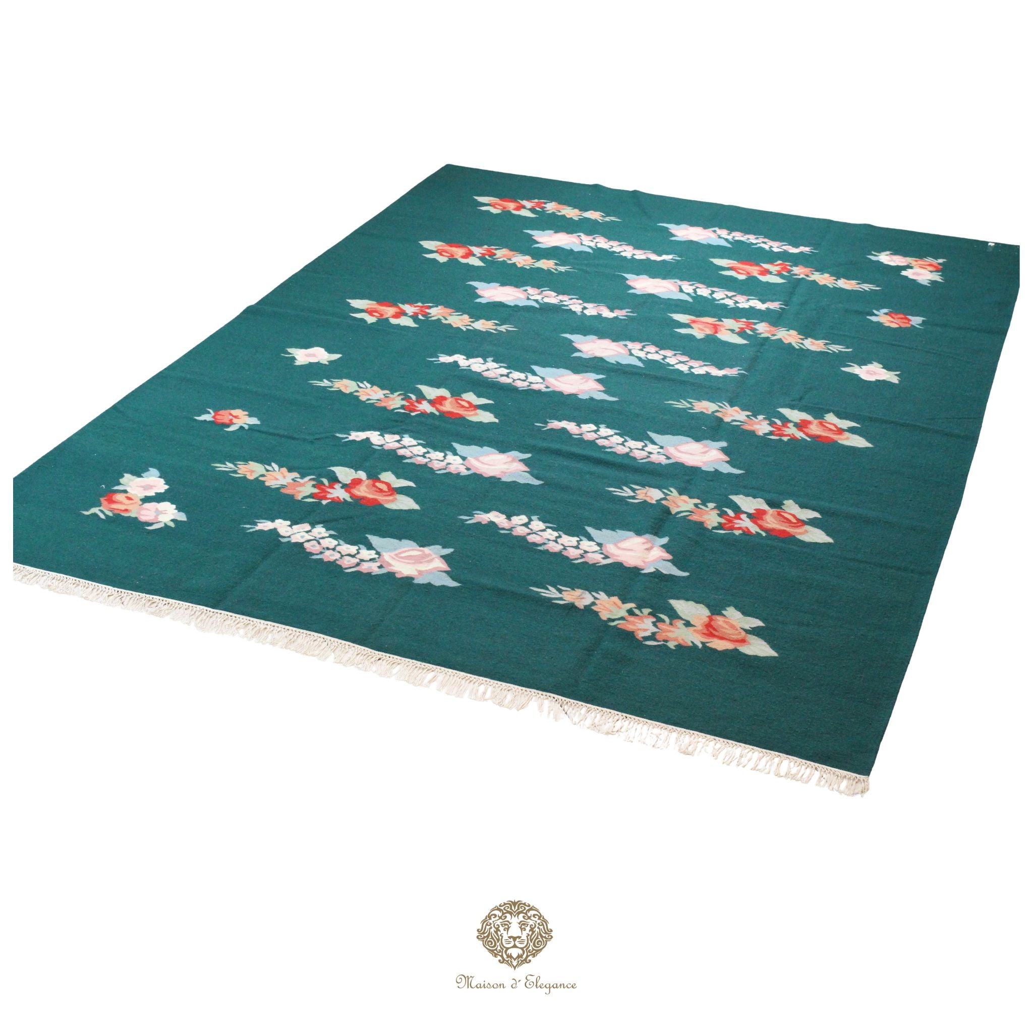 Teal tablecloth with floral patterns on a green background