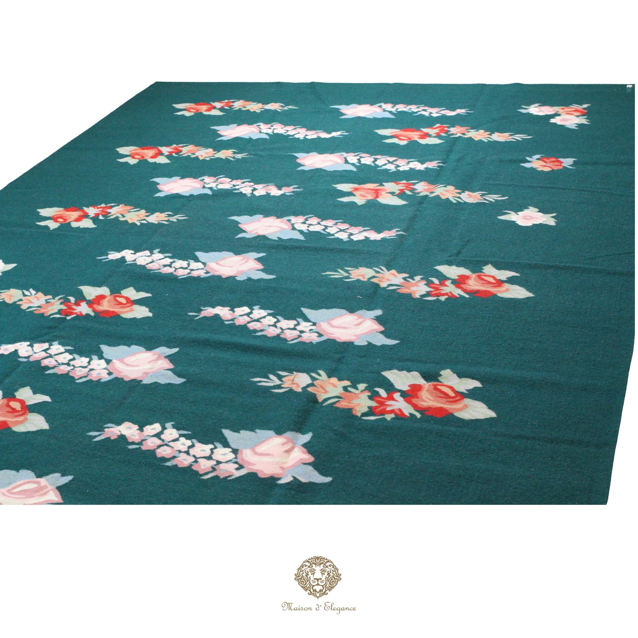 Floral patterned fabric on a teal background with a brand logo at the bottom.
