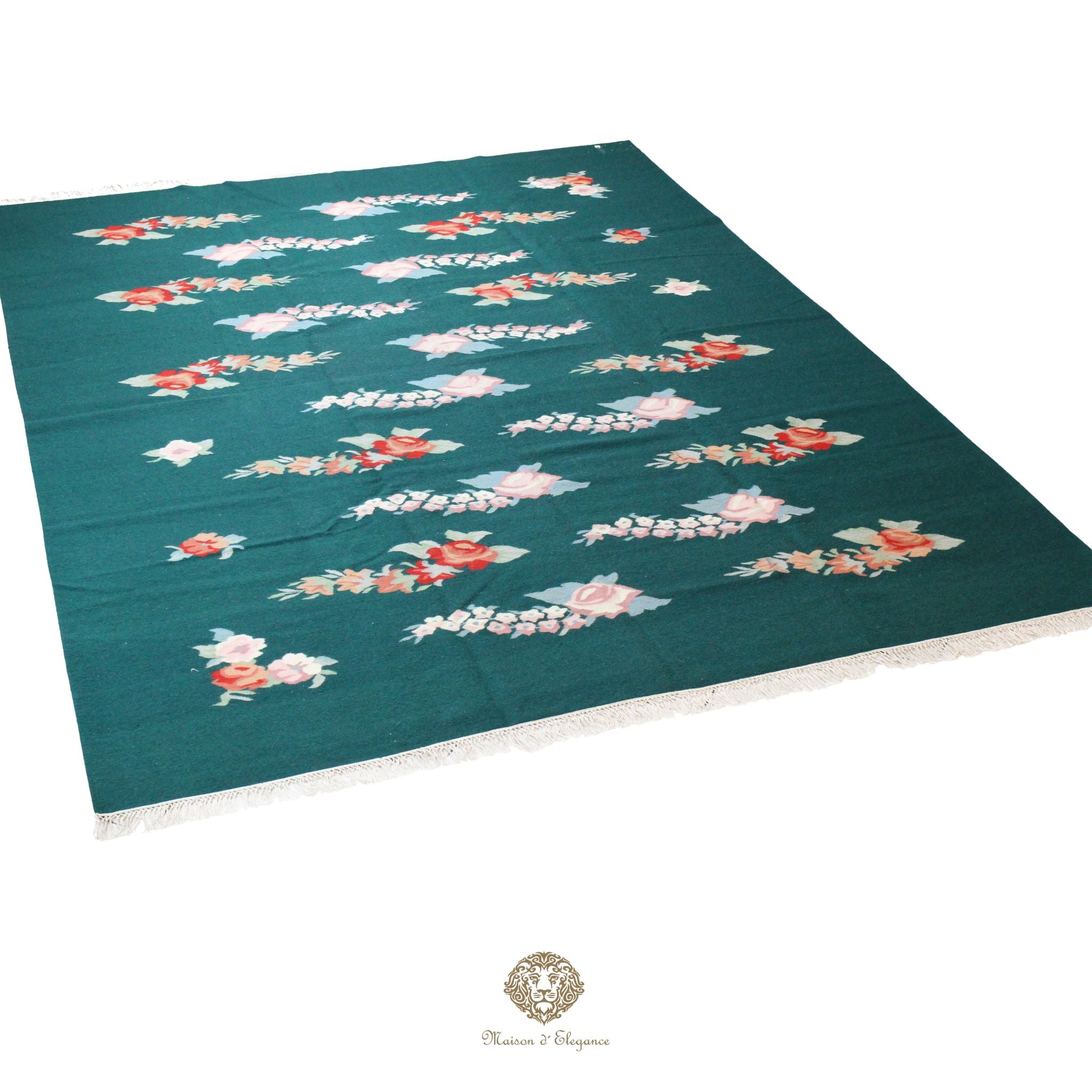 Teal tablecloth with floral patterns on a white background