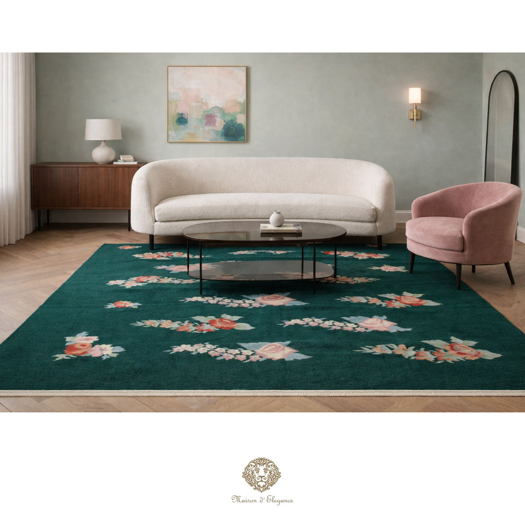 Living room with a floral-patterned rug, beige sofa, and pink armchair.