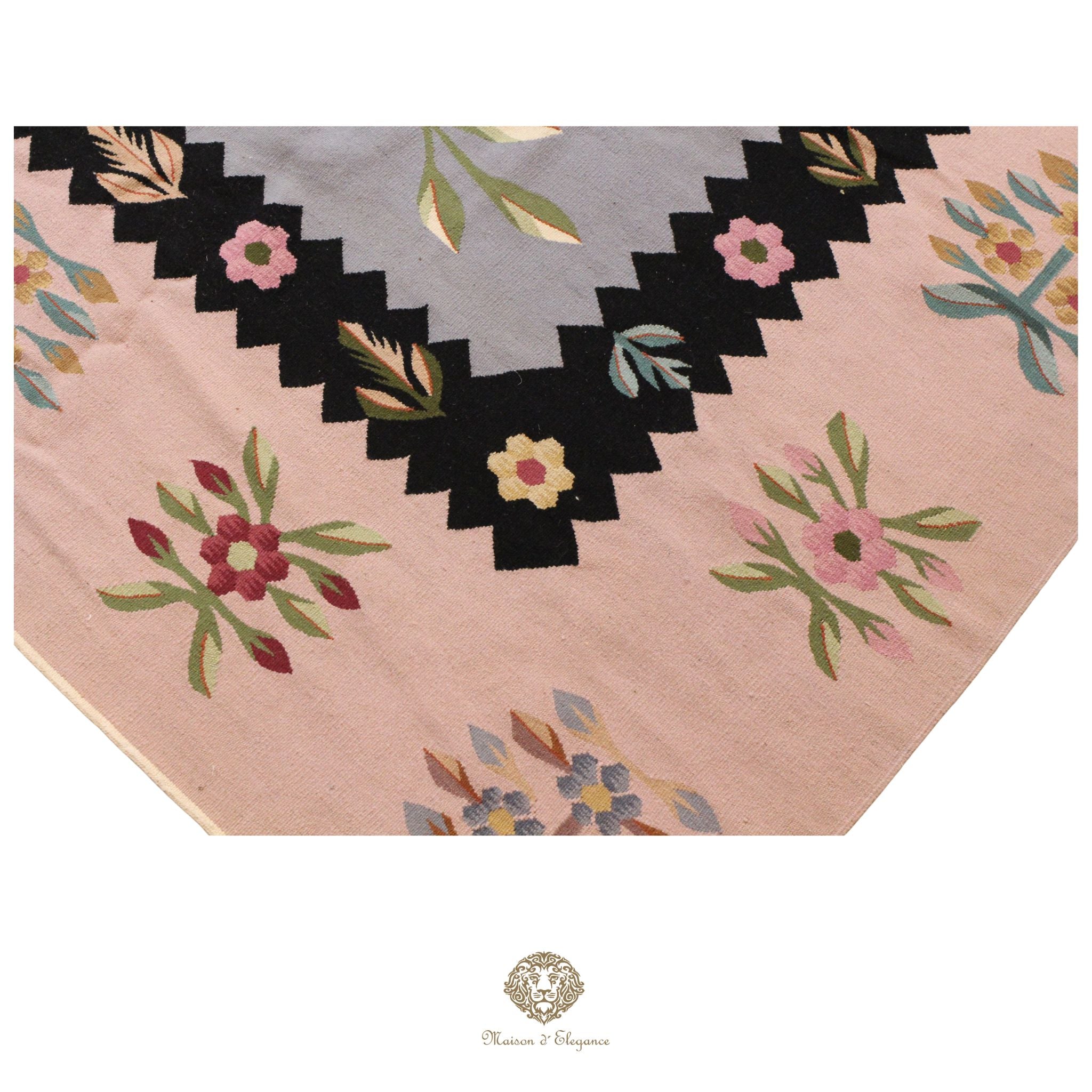 Decorative European rug with floral border on a gray background