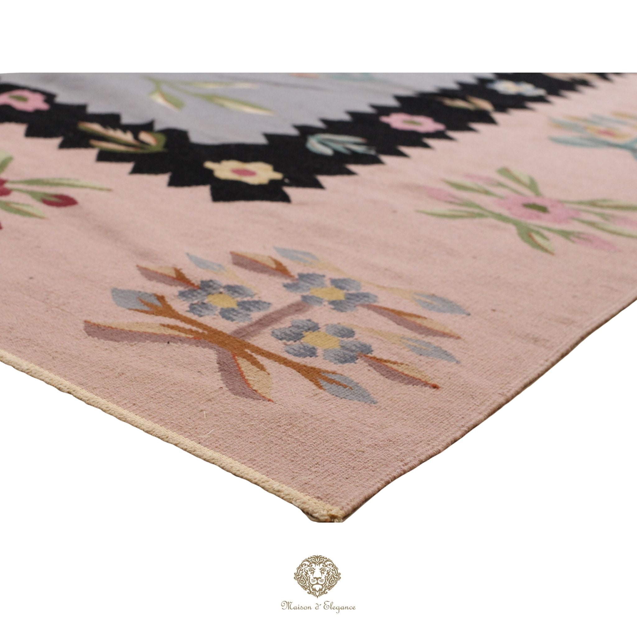 Decorative European rug with floral border on a gray background