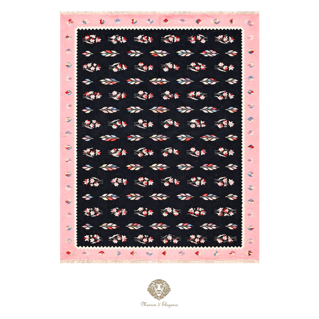 Scarf with floral pattern on a black background, framed by pink border