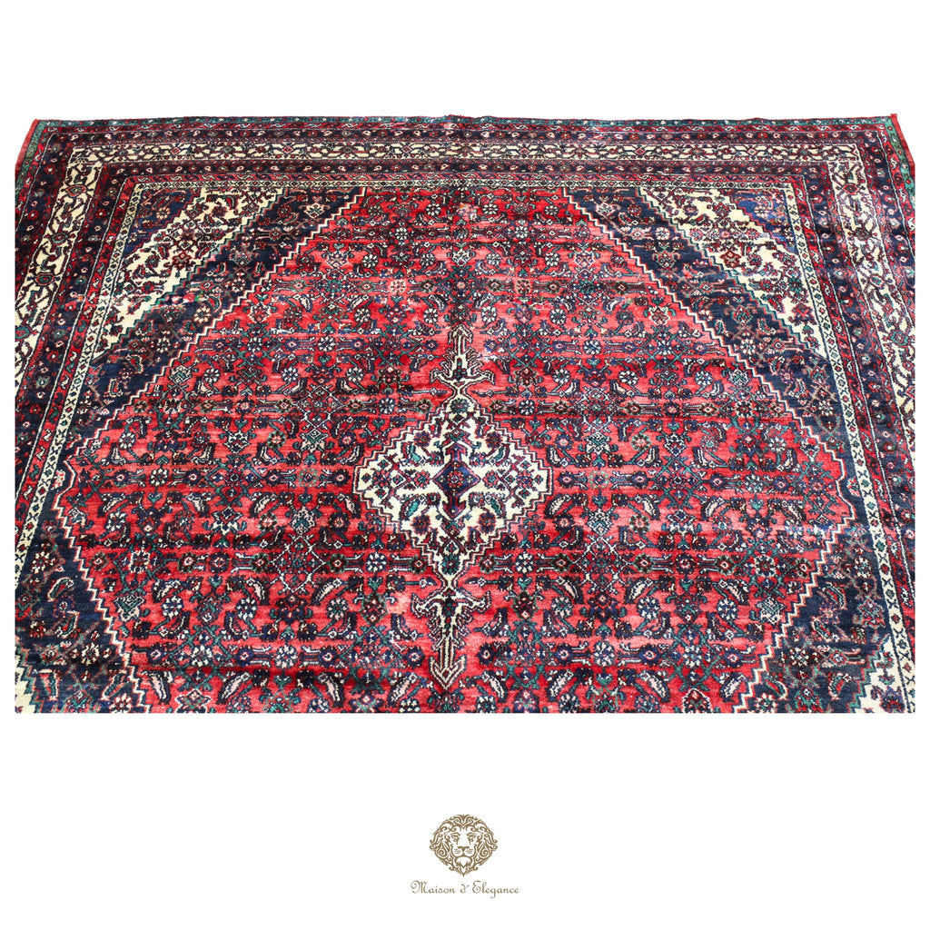 Decorative rug with intricate patterns on a red background
