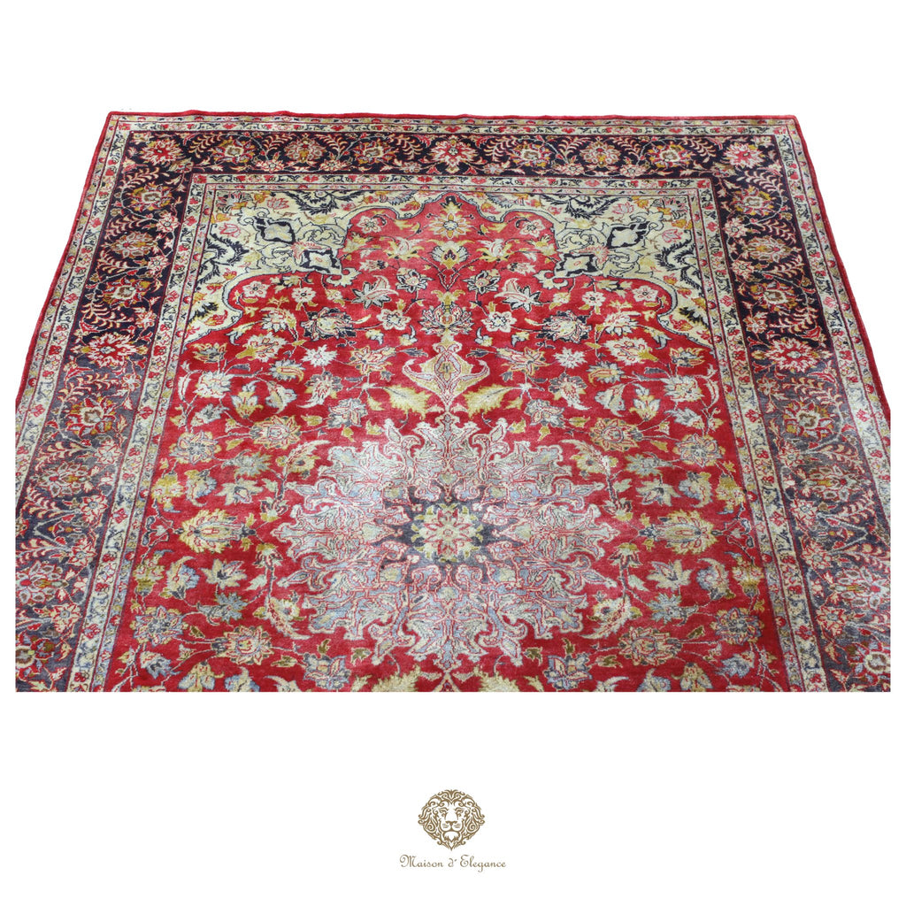Decorative rug with intricate patterns on a red background