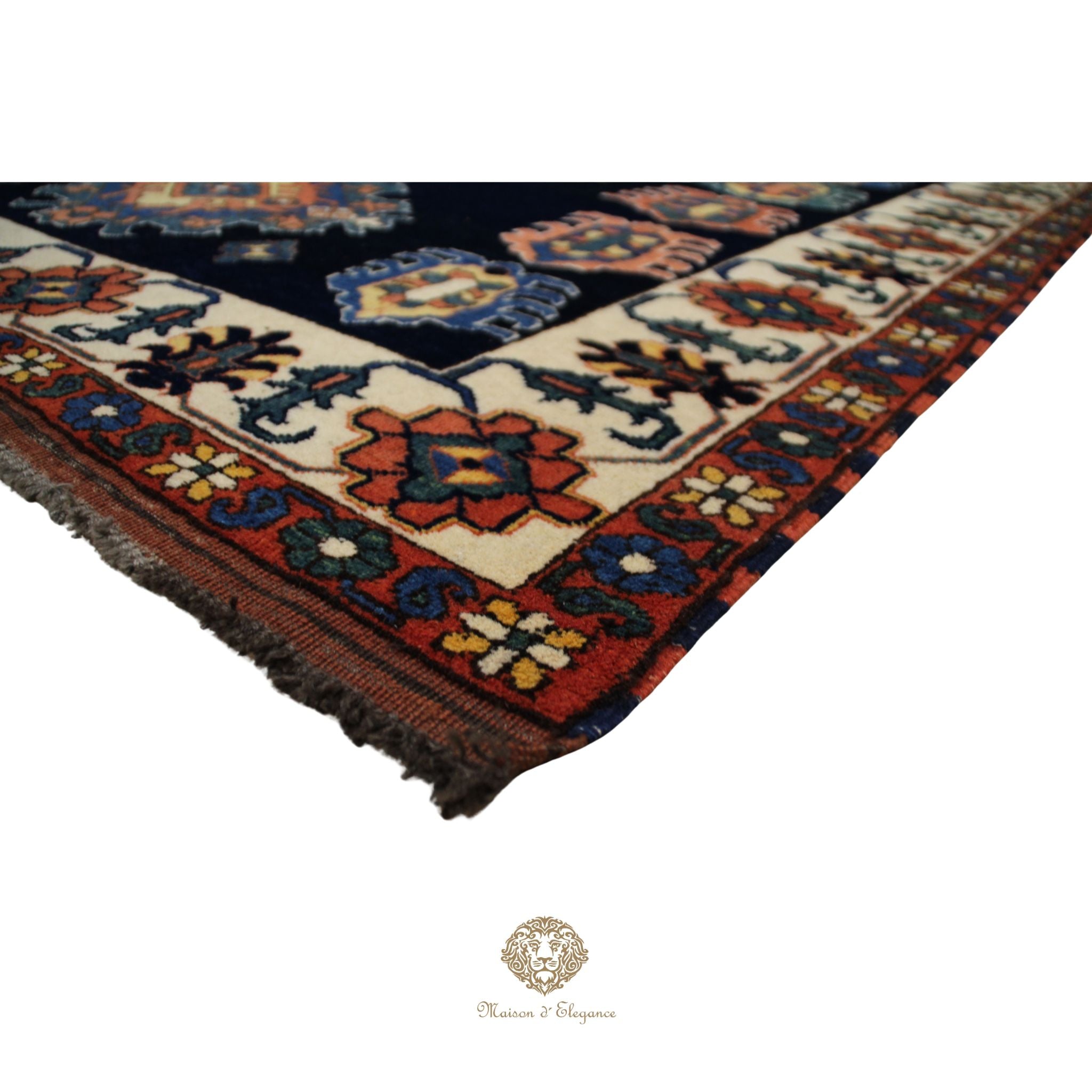 Decorative rug with intricate patterns on a navy background