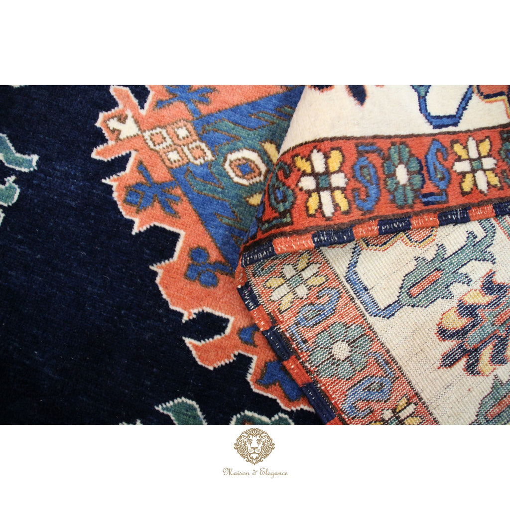 Close-up of a colorful patterned rug with intricate designs.