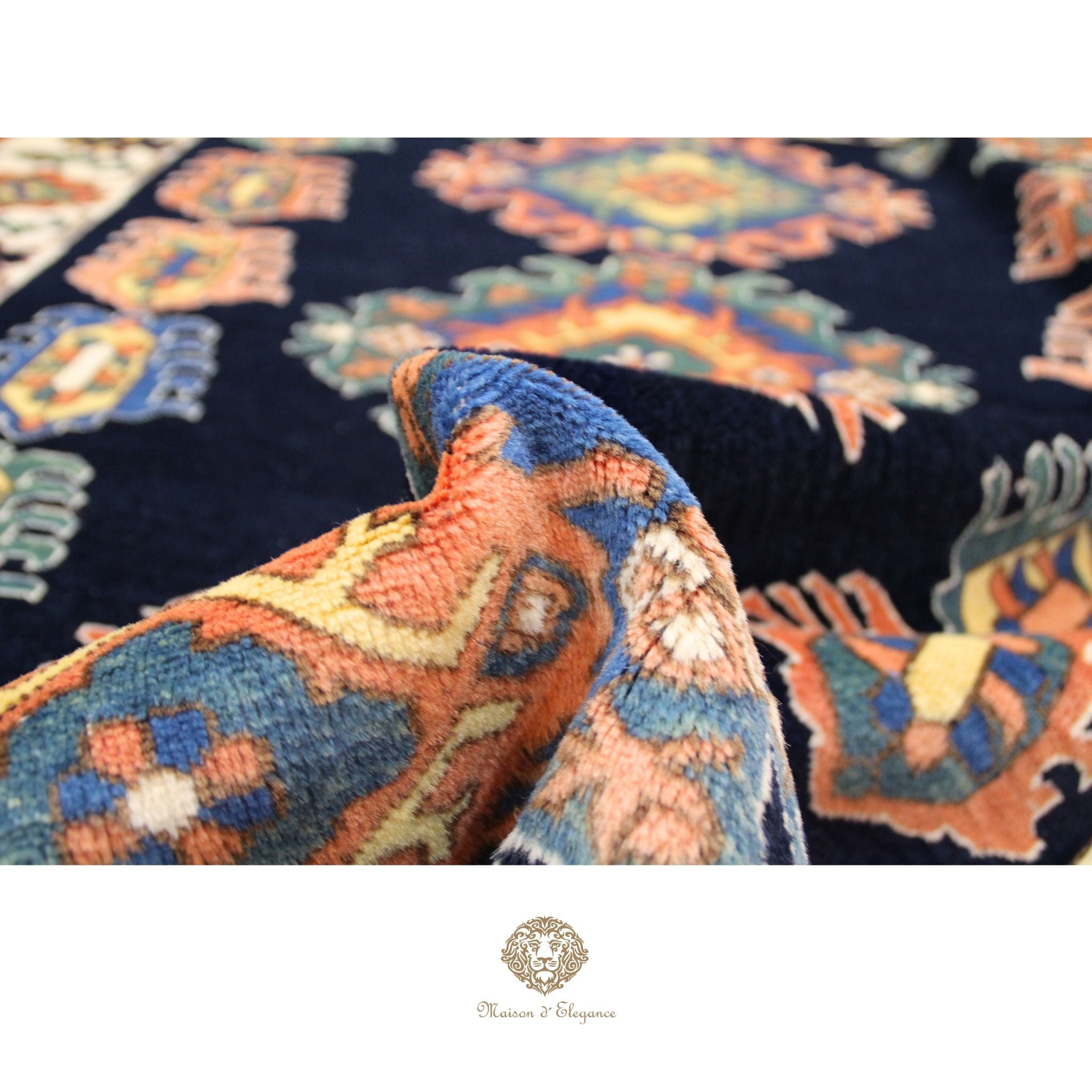 Close-up of a patterned fabric with intricate designs on a dark background, featuring a brand logo at the bottom.