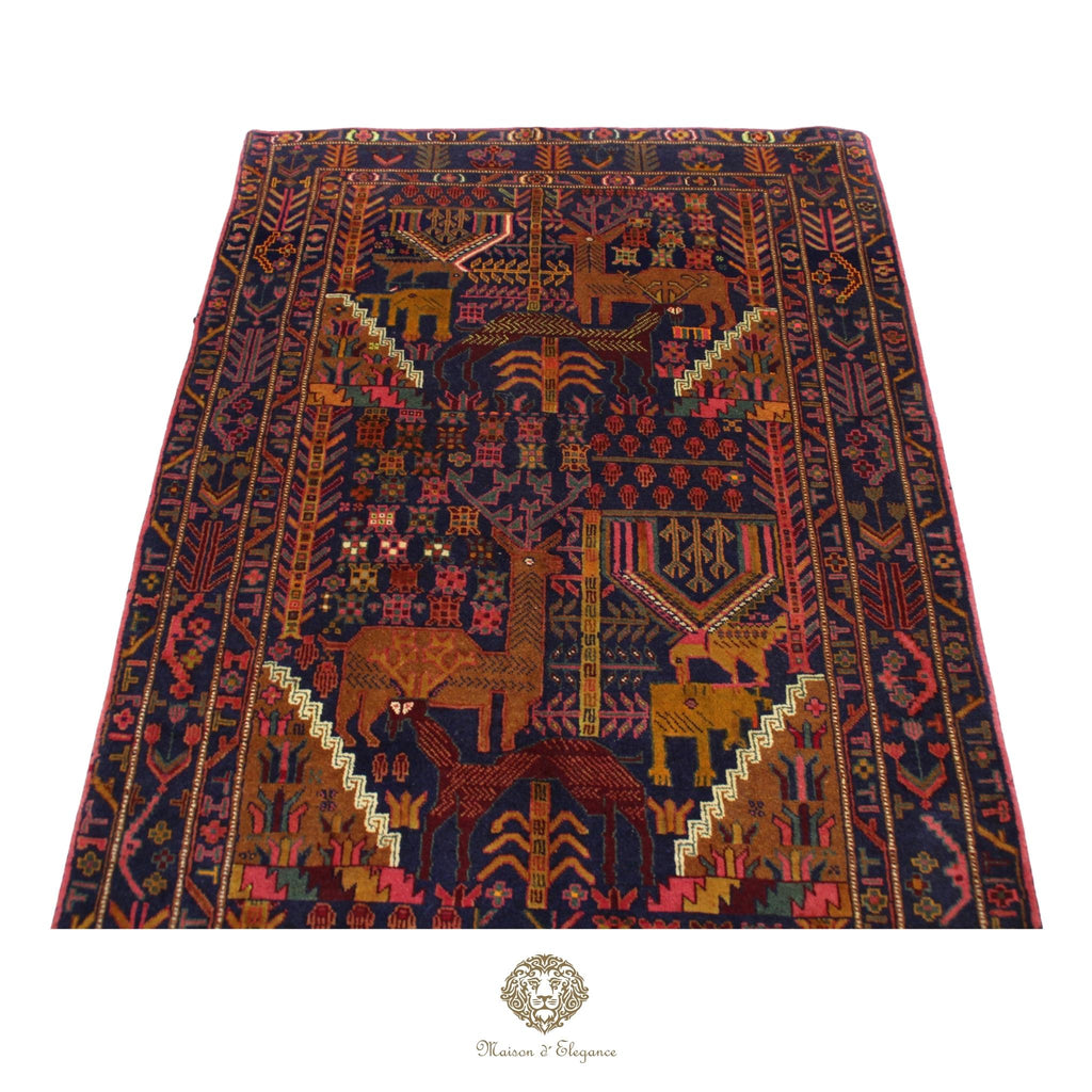 Decorative rug with intricate patterns and animal designs on a navy background