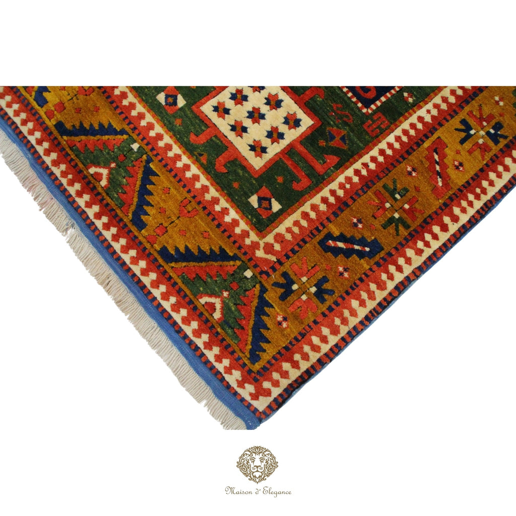 Corner of a colorful patterned rug with geometric designs on a white background