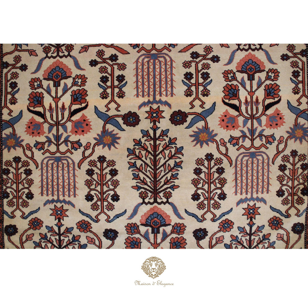 Decorative rug with intricate floral and geometric patterns on a ivory background, featuring 
