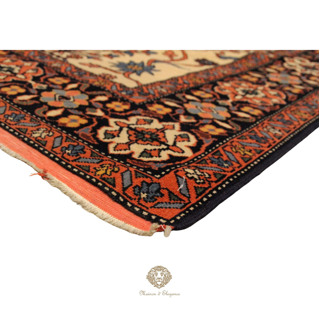 Close-up of a patterned rug with intricate designs on a ivory background