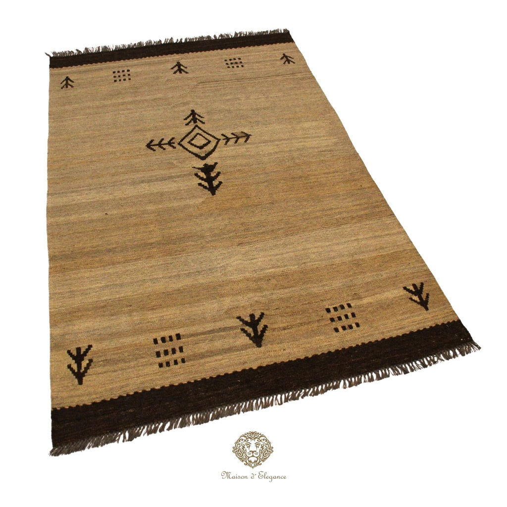Beige rug with black geometric patterns on a ivory background