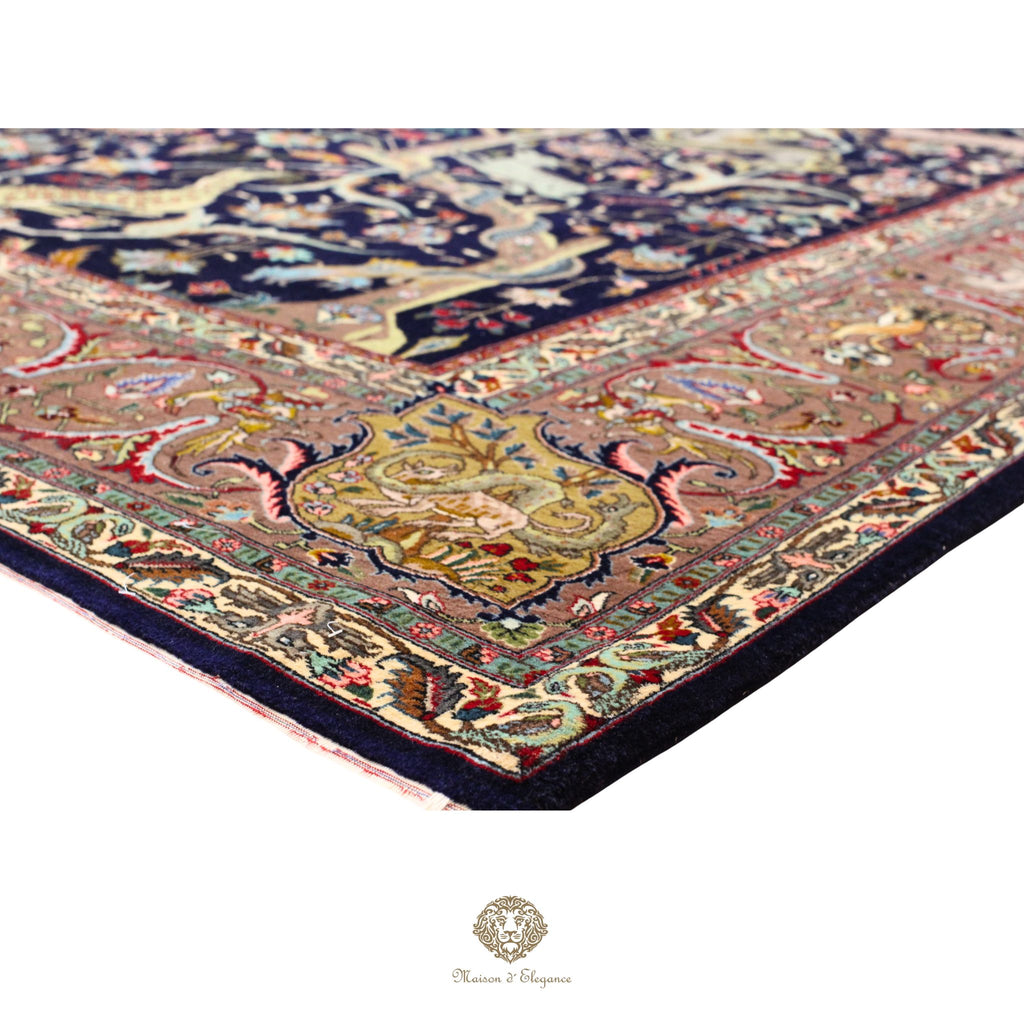 Close-up of an intricately designed rug with a prominent central pattern on a white background.