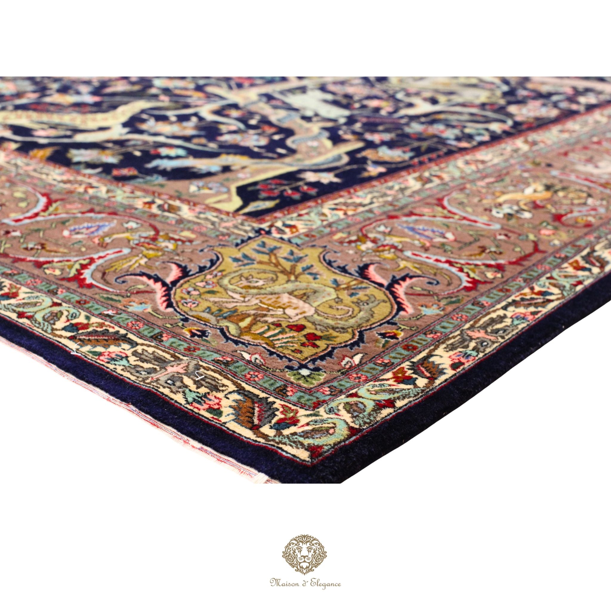 Close-up of an intricately designed rug with a prominent central pattern on a white background.