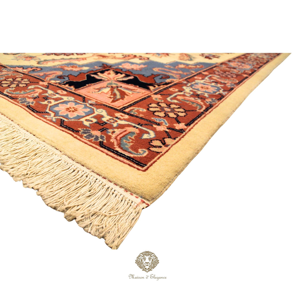 Decorative rug with intricate patterns and tassels on a Ivory background