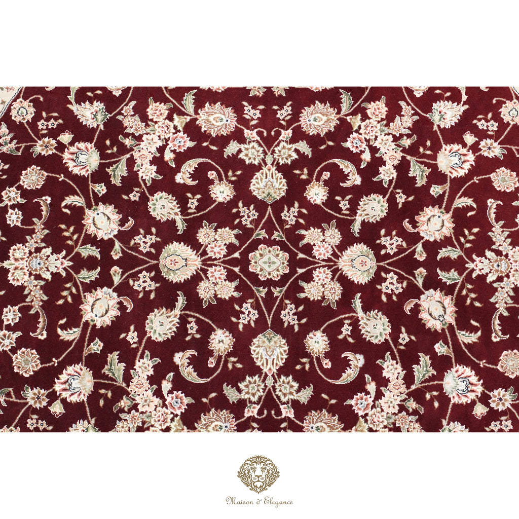 Floral patterned fabric with intricate design on a red background