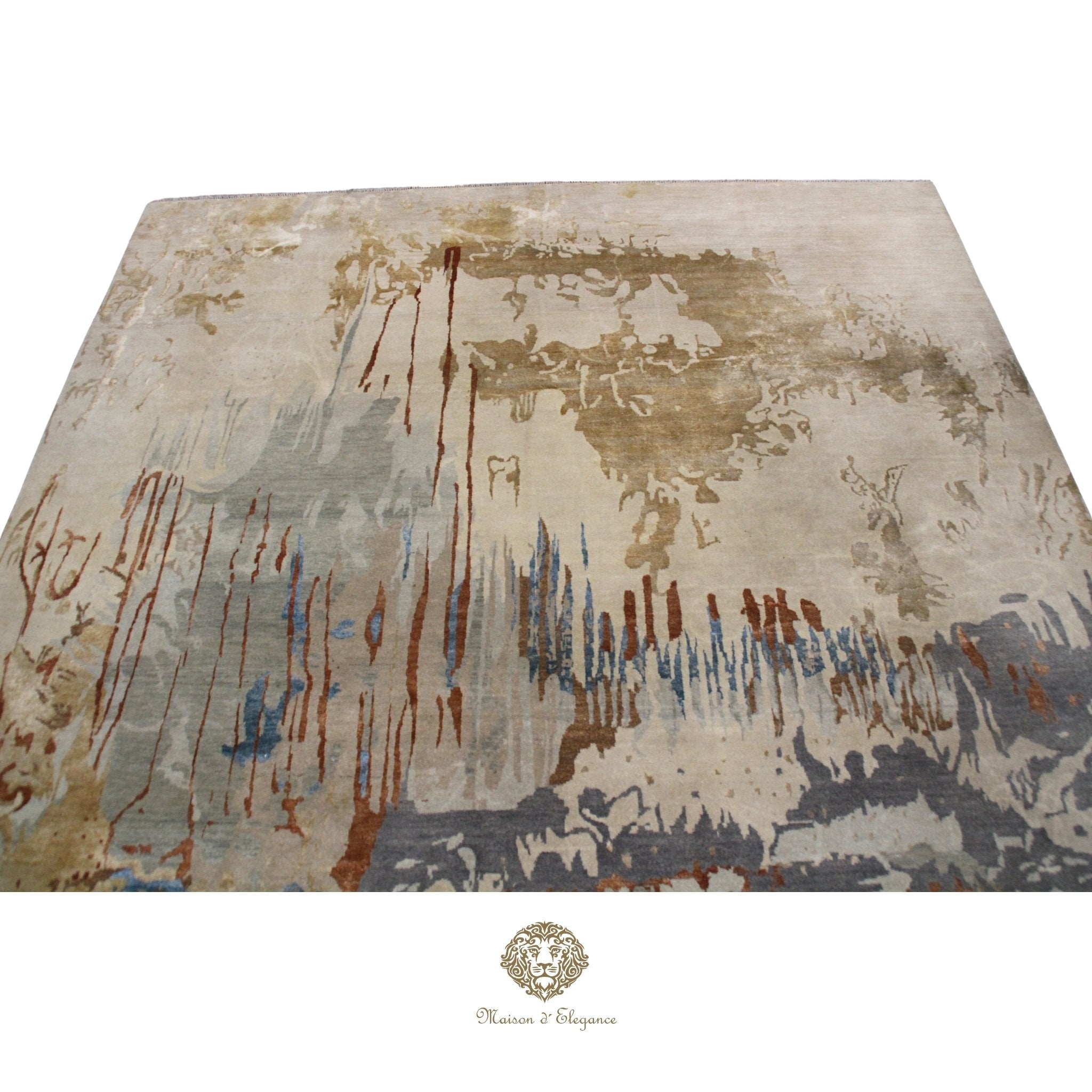 Abstract patterned rug with brown, blue, and beige colors on a Ivory background