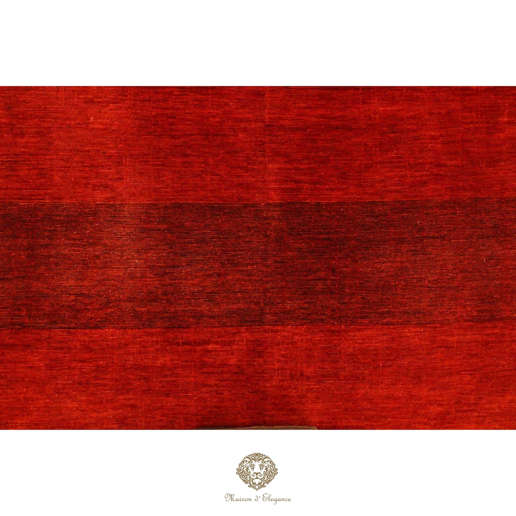 Red textured fabric swatch with a brand logo at the bottom right corner.