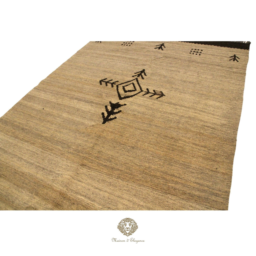 Beige rug with black geometric patterns on a ivory background