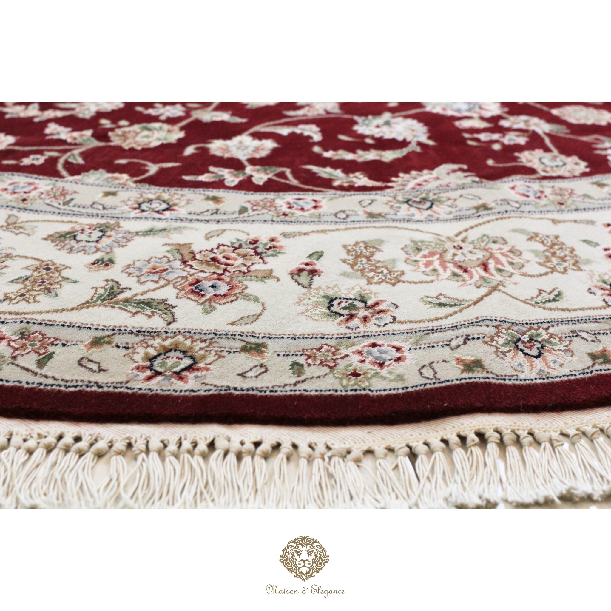 Decorative rug with intricate patterns and fringes on a red background
