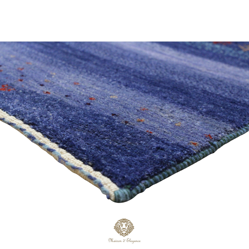 Blue textured rug with a brand logo in the corner