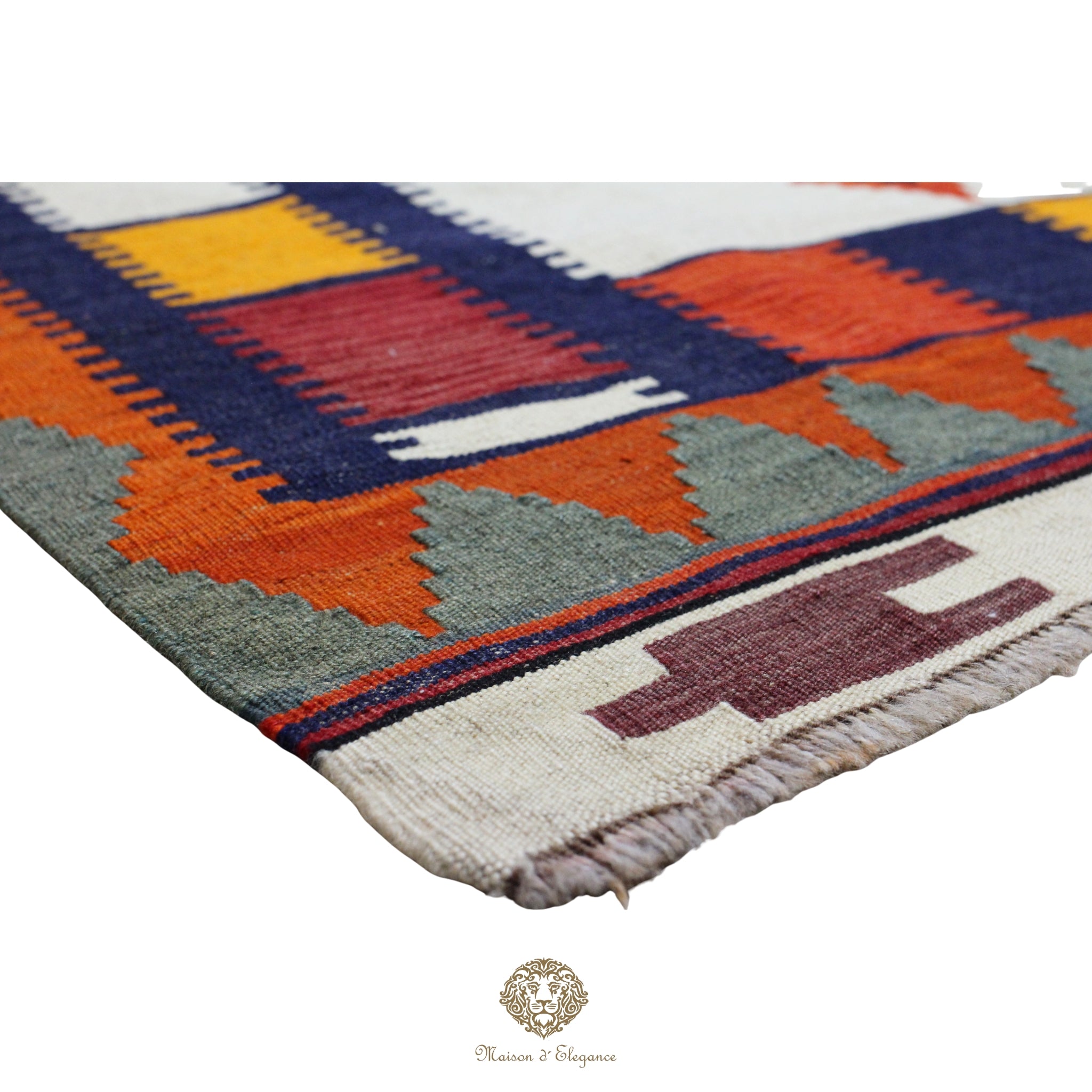 Close-up of a colorful patterned rug with geometric design on a white background.
