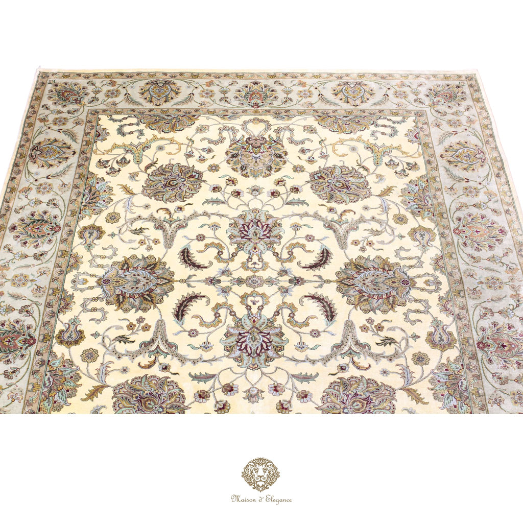 Decorative rug with intricate patterns on a ivory background