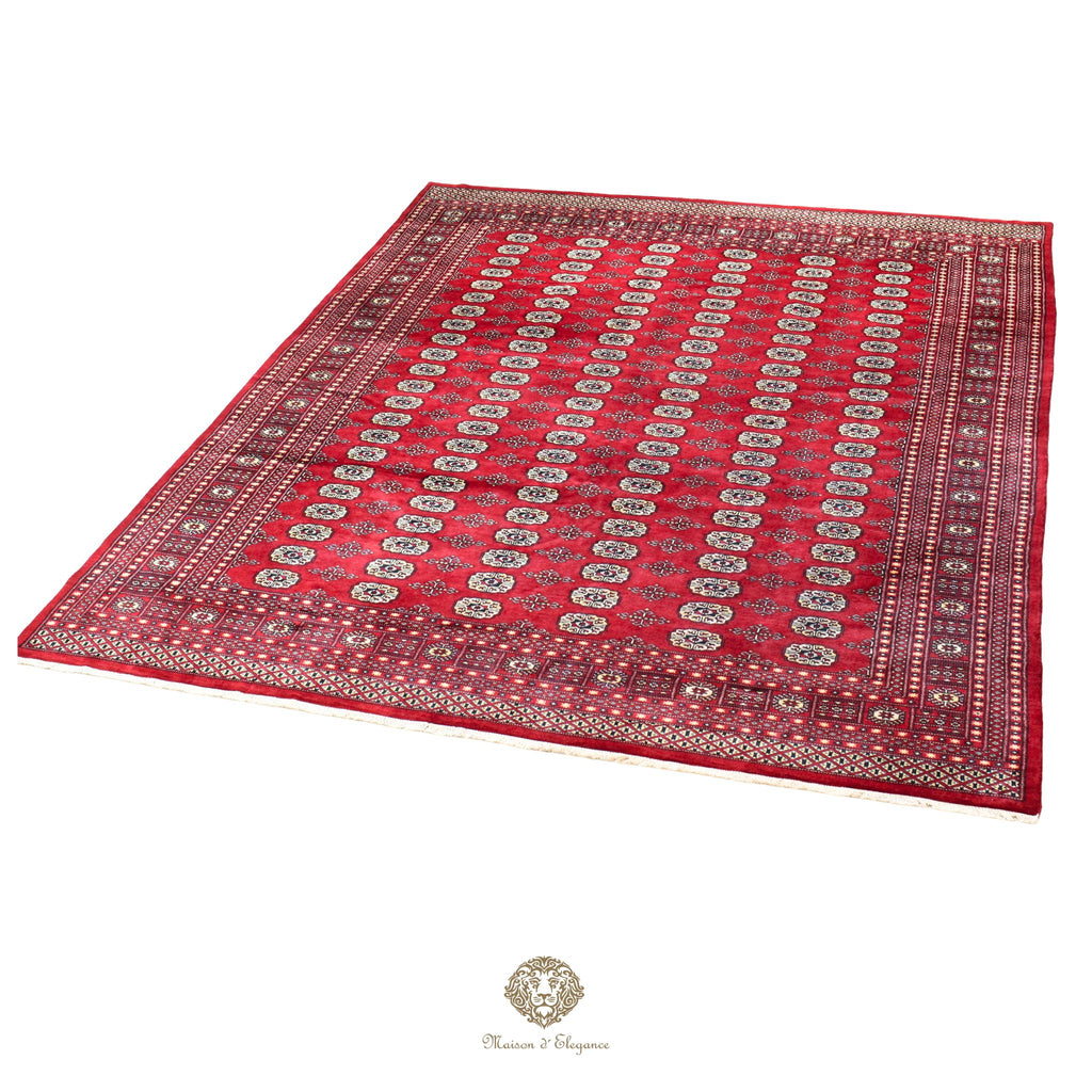 Red patterned rug with intricate designs on a red background