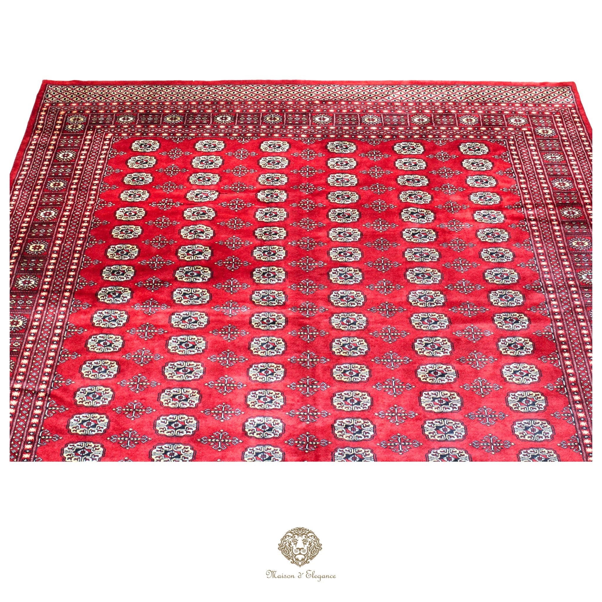 Red patterned fabric with intricate design on a red background
