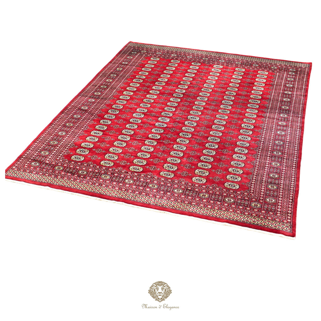 Red patterned rug with gold accents on a red background