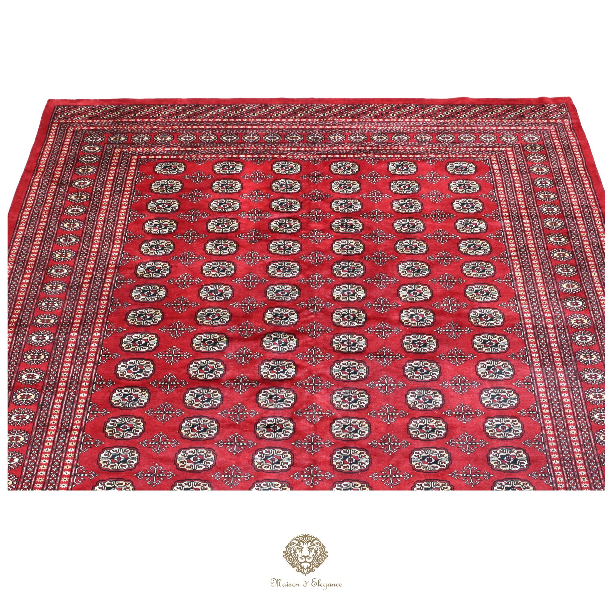 Red patterned fabric with intricate designs on a white background