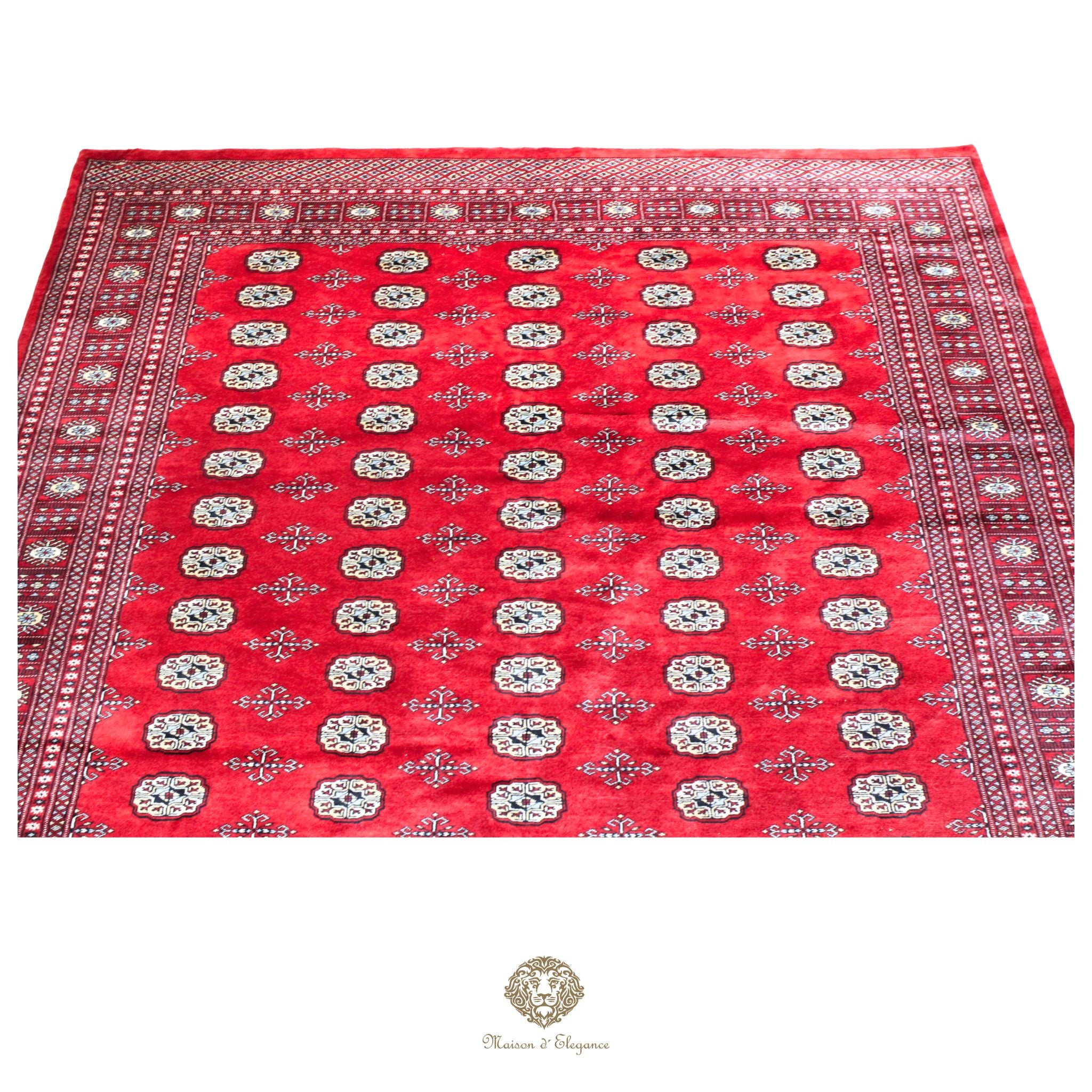 Red patterned fabric with white designs on a red background