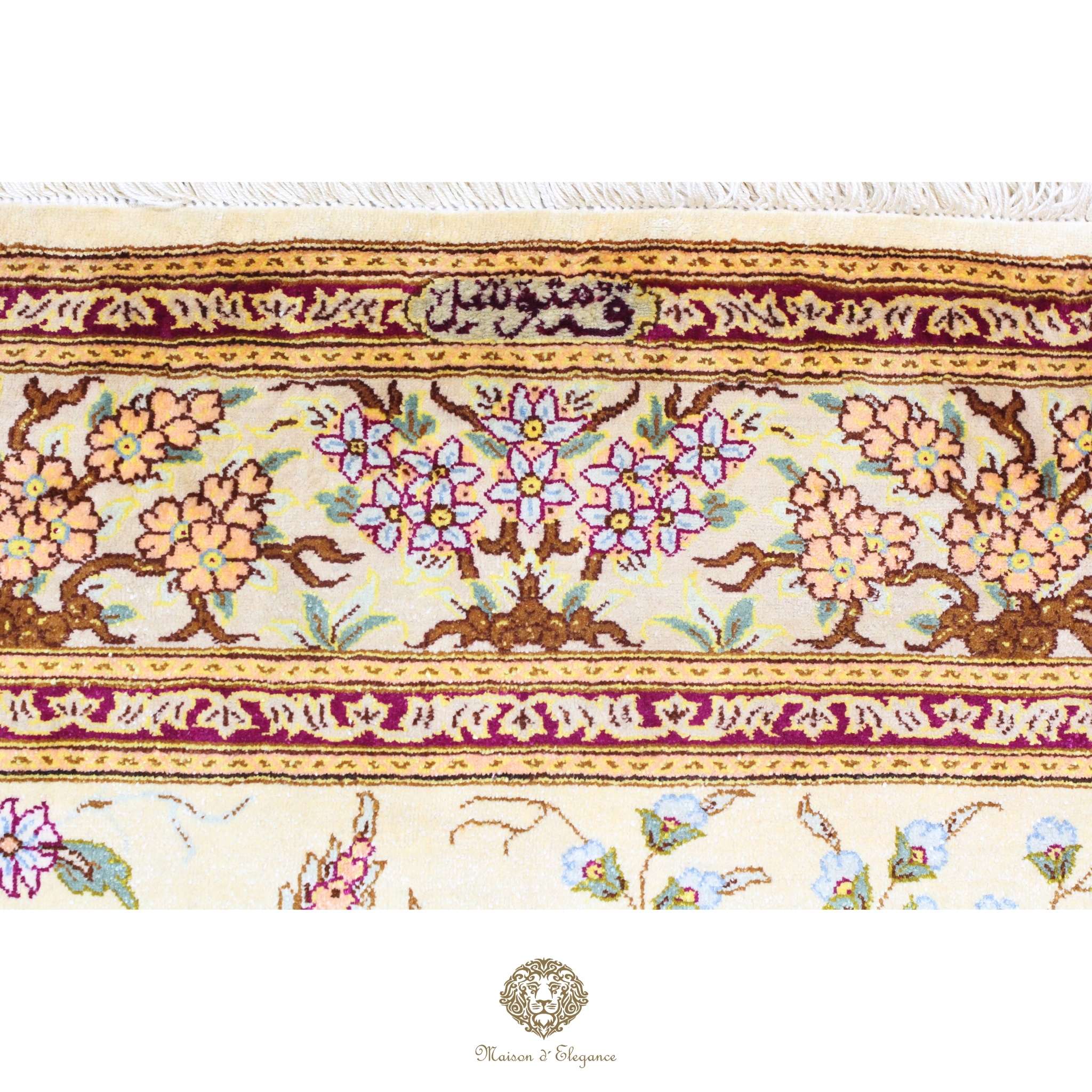 Decorative rug with floral patterns and intricate border on a white background