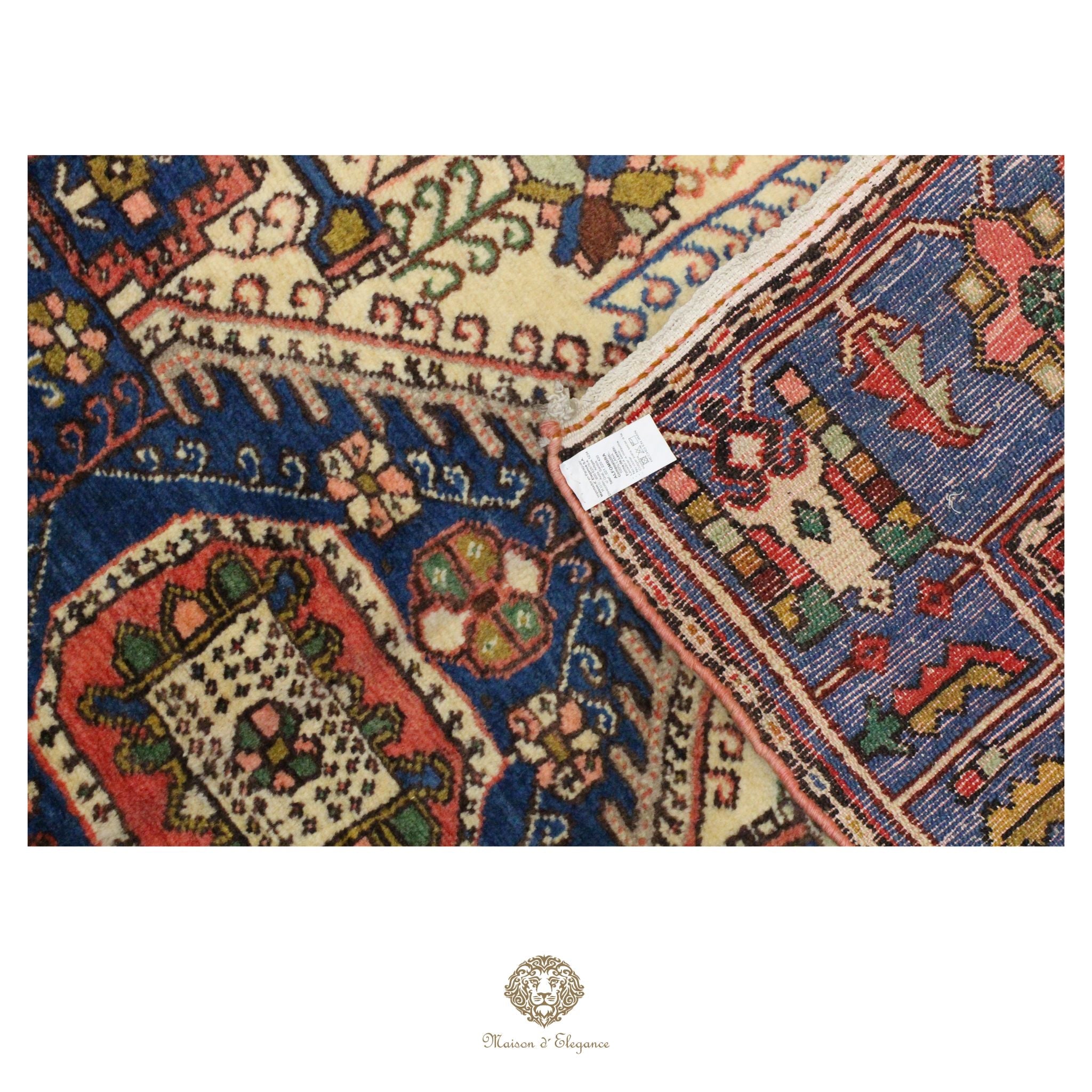 Close-up of a patterned rug with intricate designs on a white background