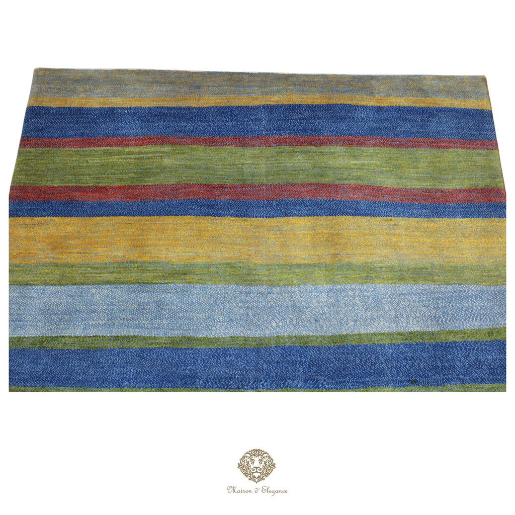 Striped rug with blue, green, and red colors on a colorida background