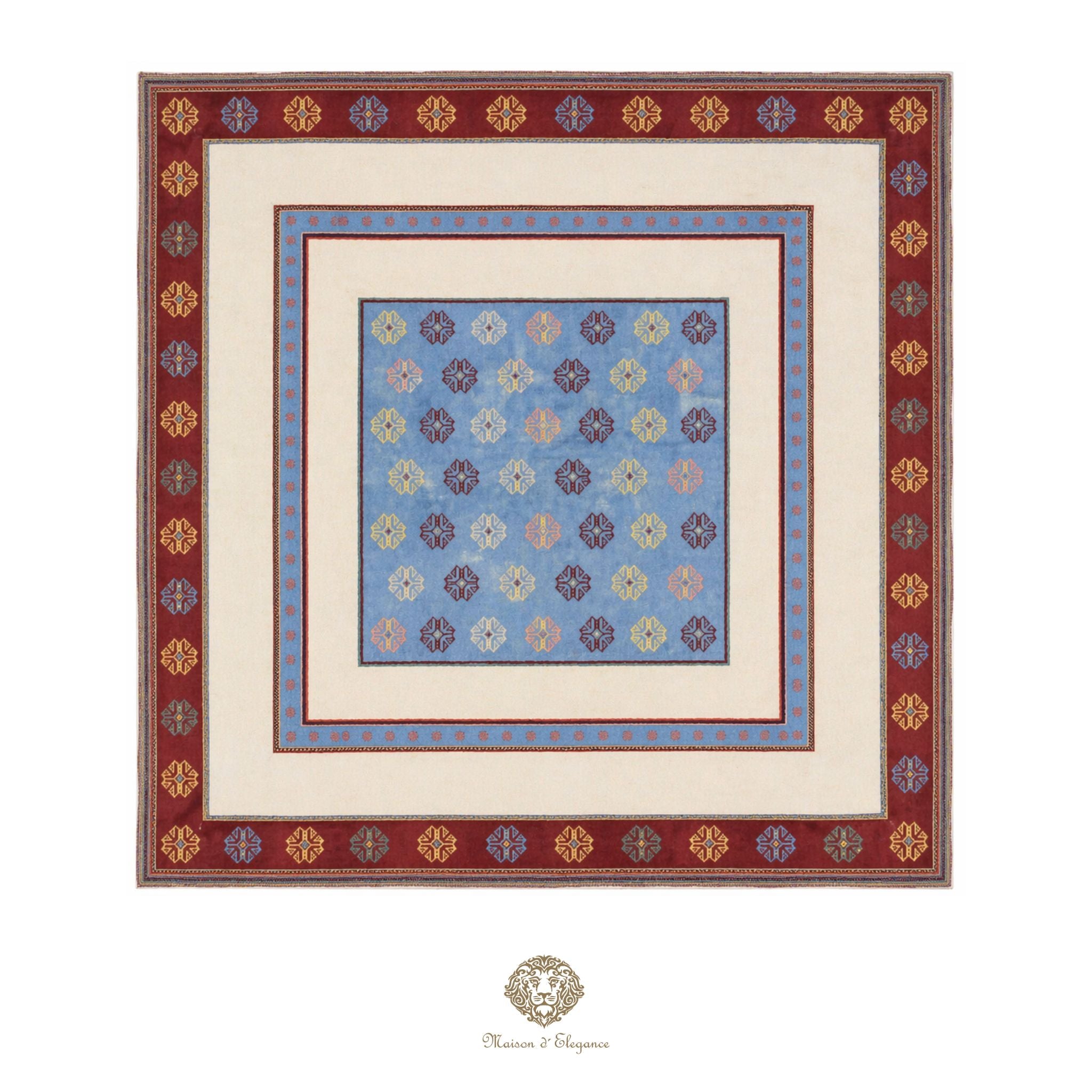 Decorative quilt with floral pattern and intricate border on a white background