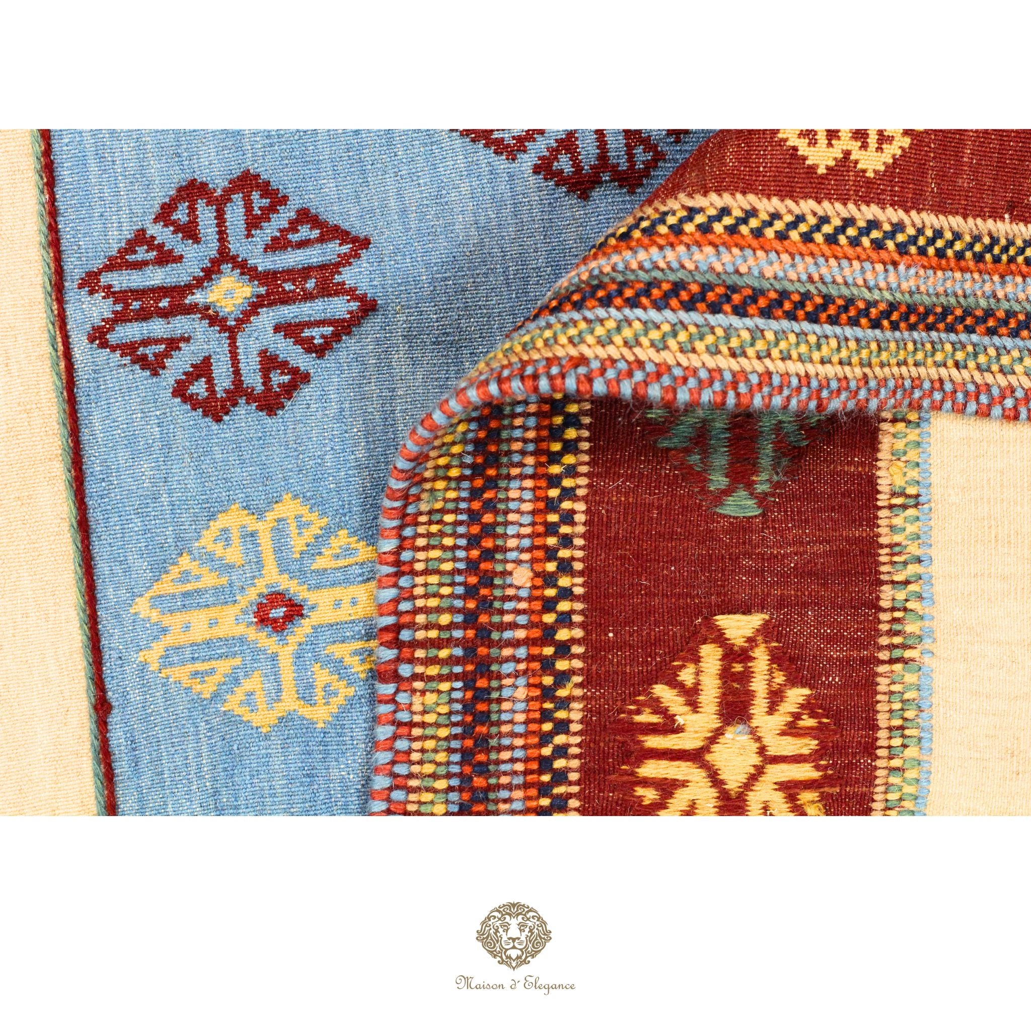 Close-up of a colorful woven fabric with geometric patterns on a white background.