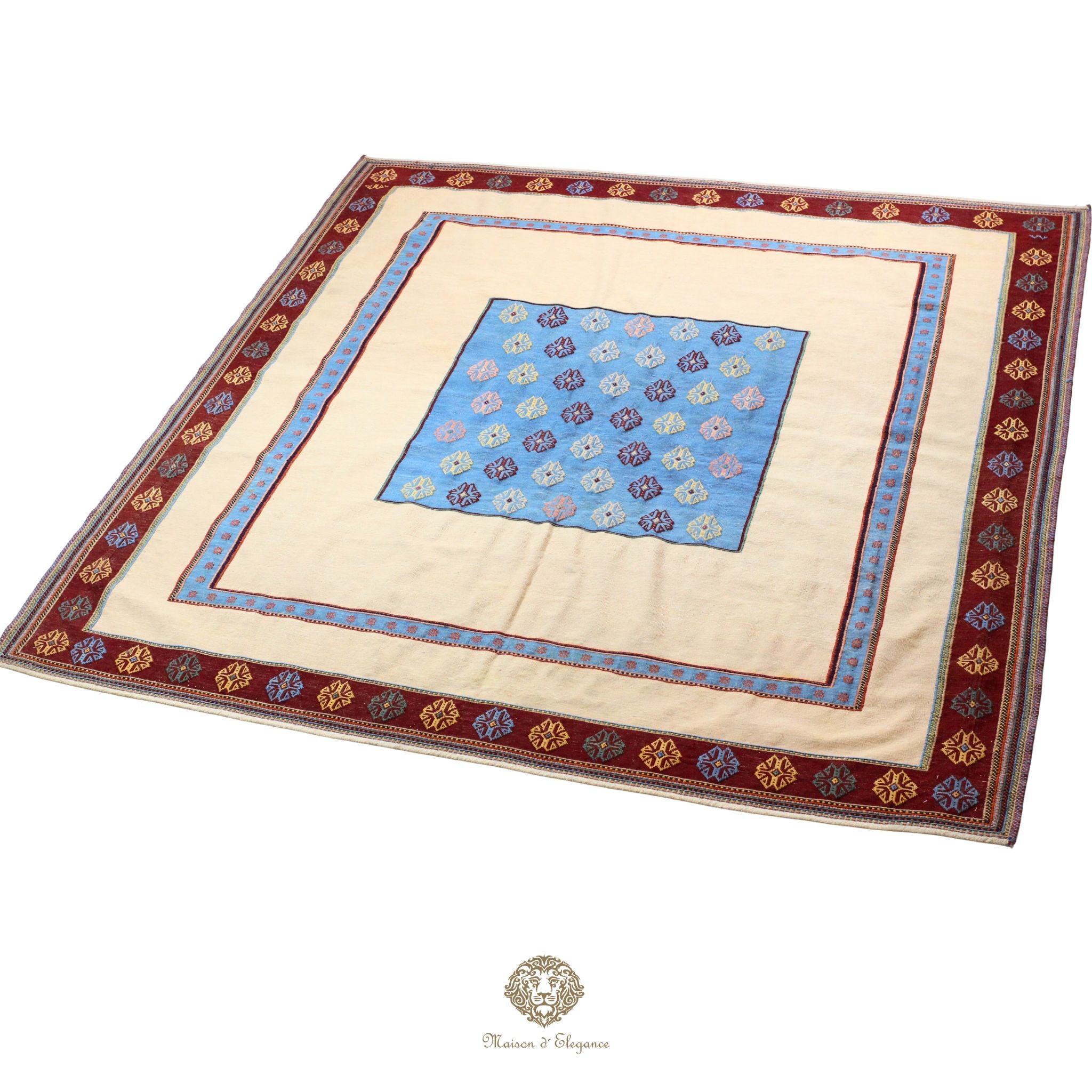 Decorative tablecloth with a blue center and beige border on a white background