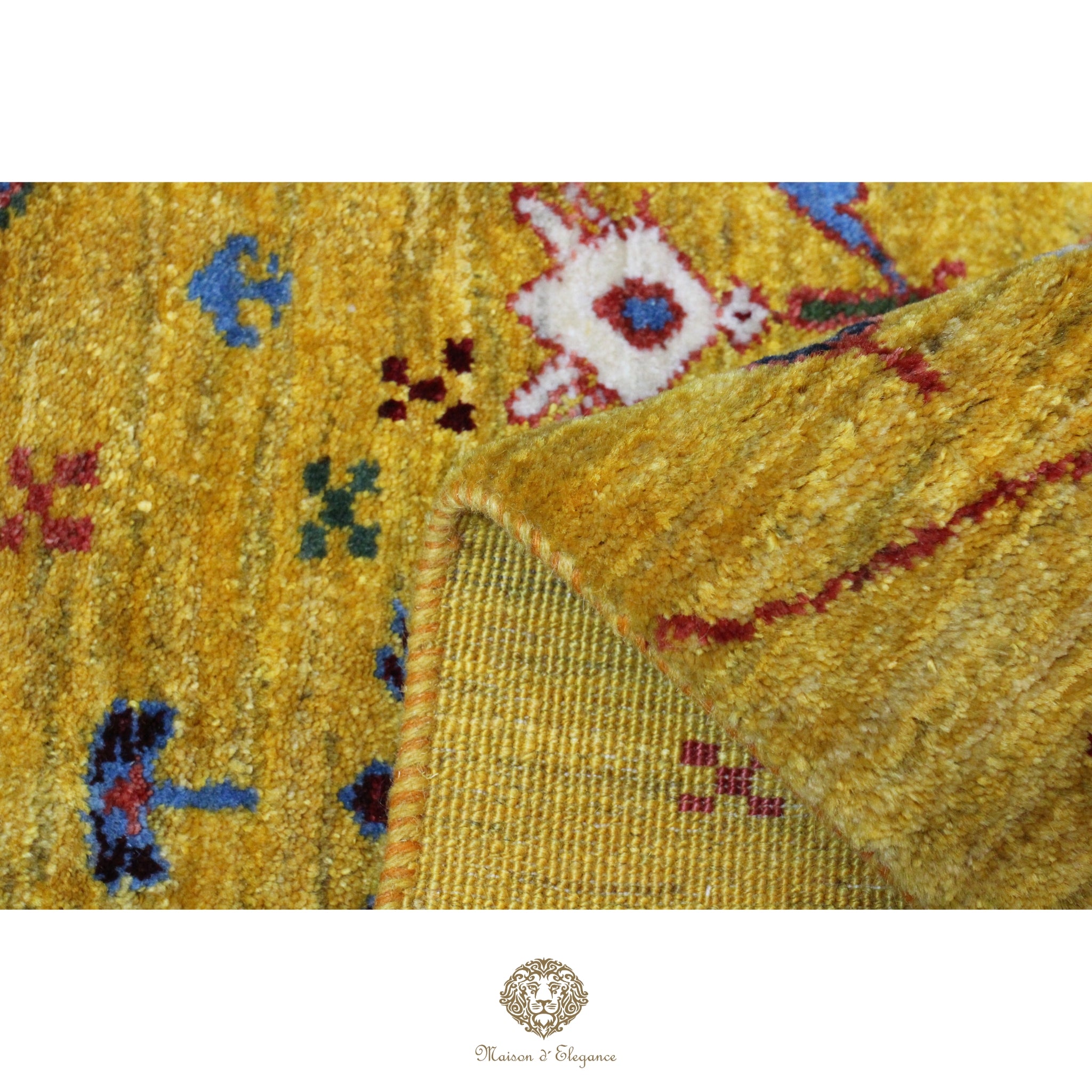 Close-up of a textured yellow fabric with floral patterns, featuring a brand logo at the bottom.